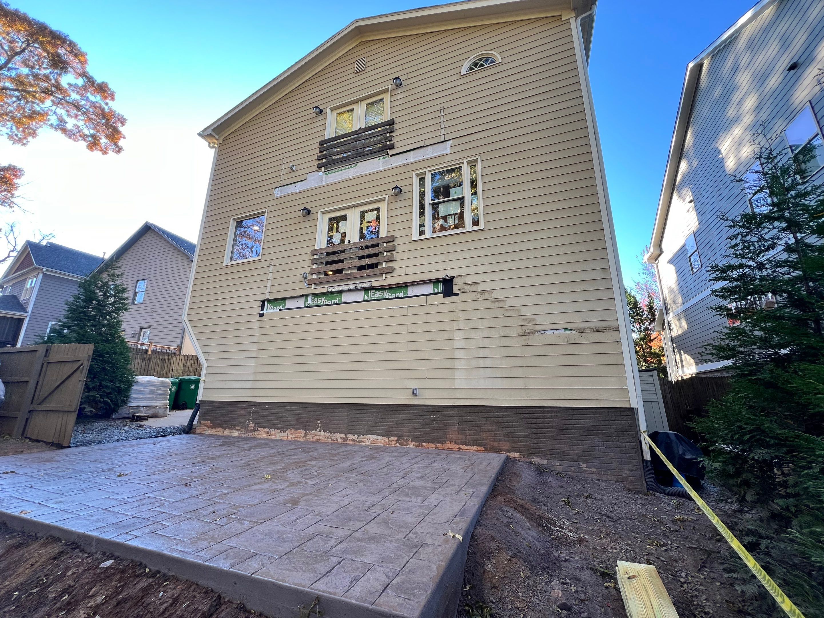 Screened-In Porch With Fireplace by Swift Home Renovations 
