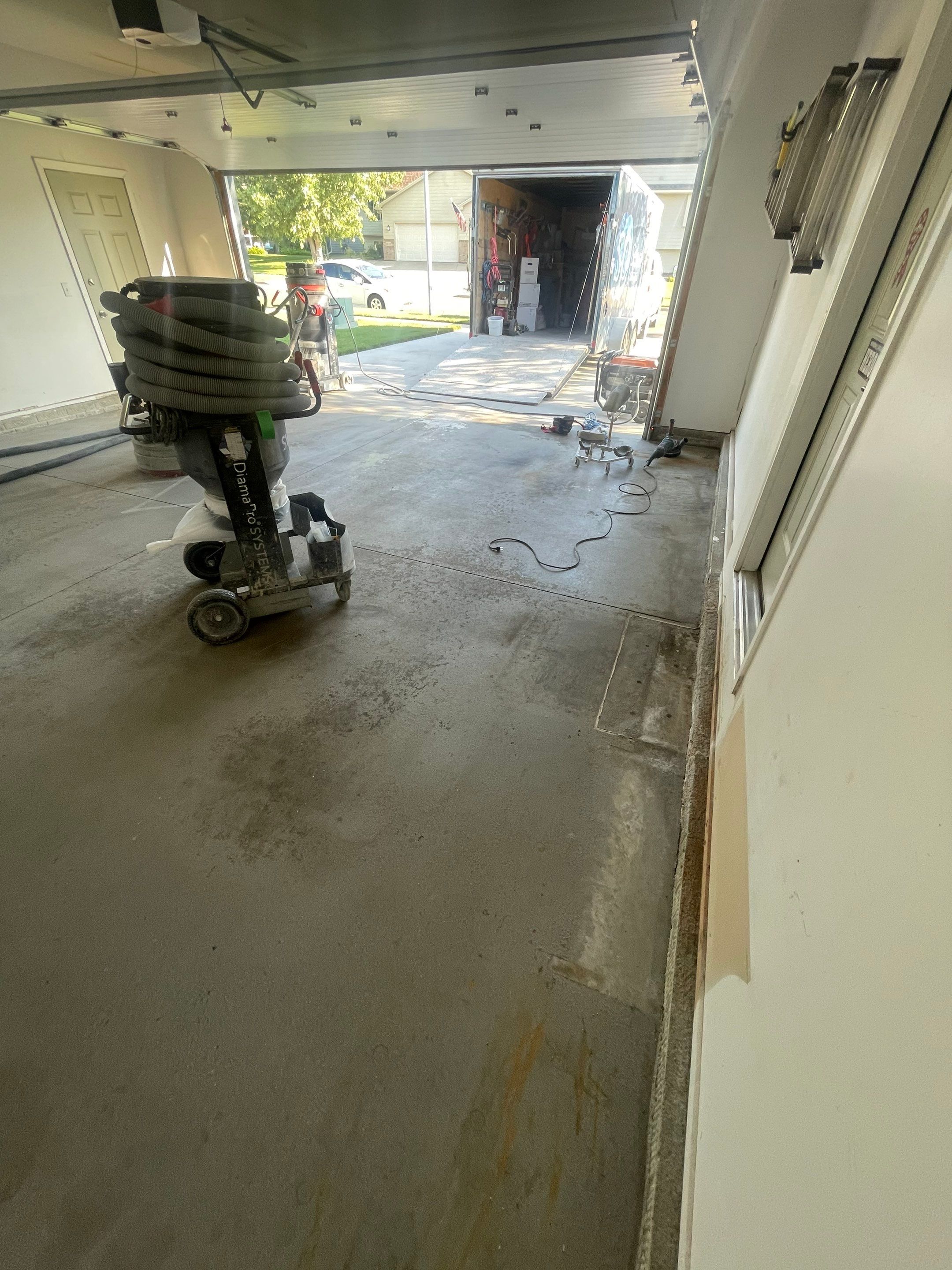 Sioux Falls Garage Floor Coating with Nightfall Decorative Chips by Select Painting, Coatings & Garage Cabinets