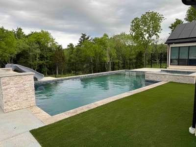 Geometric Pool with Raised Spa and Turf Surround