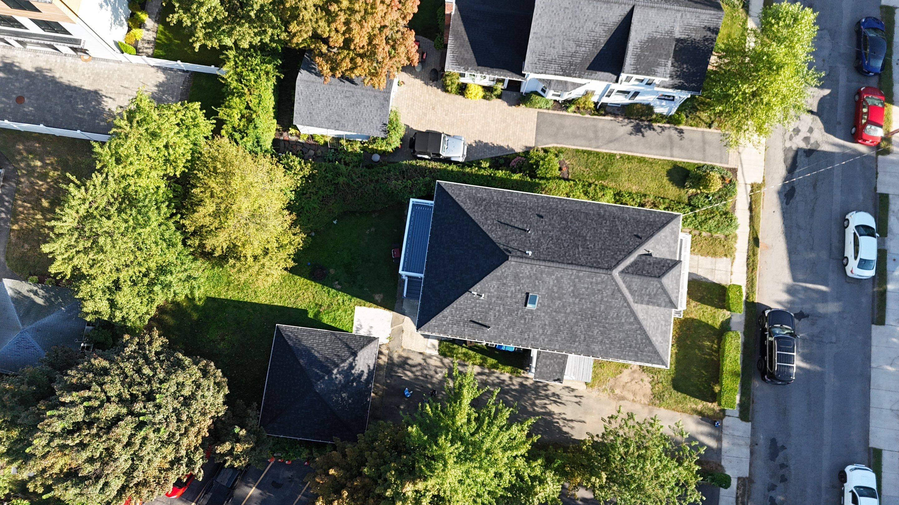 Roof Replacement with Skylight Flashing in Waltham, MA by Mighty Dog Roofing of Greater Middlesex County