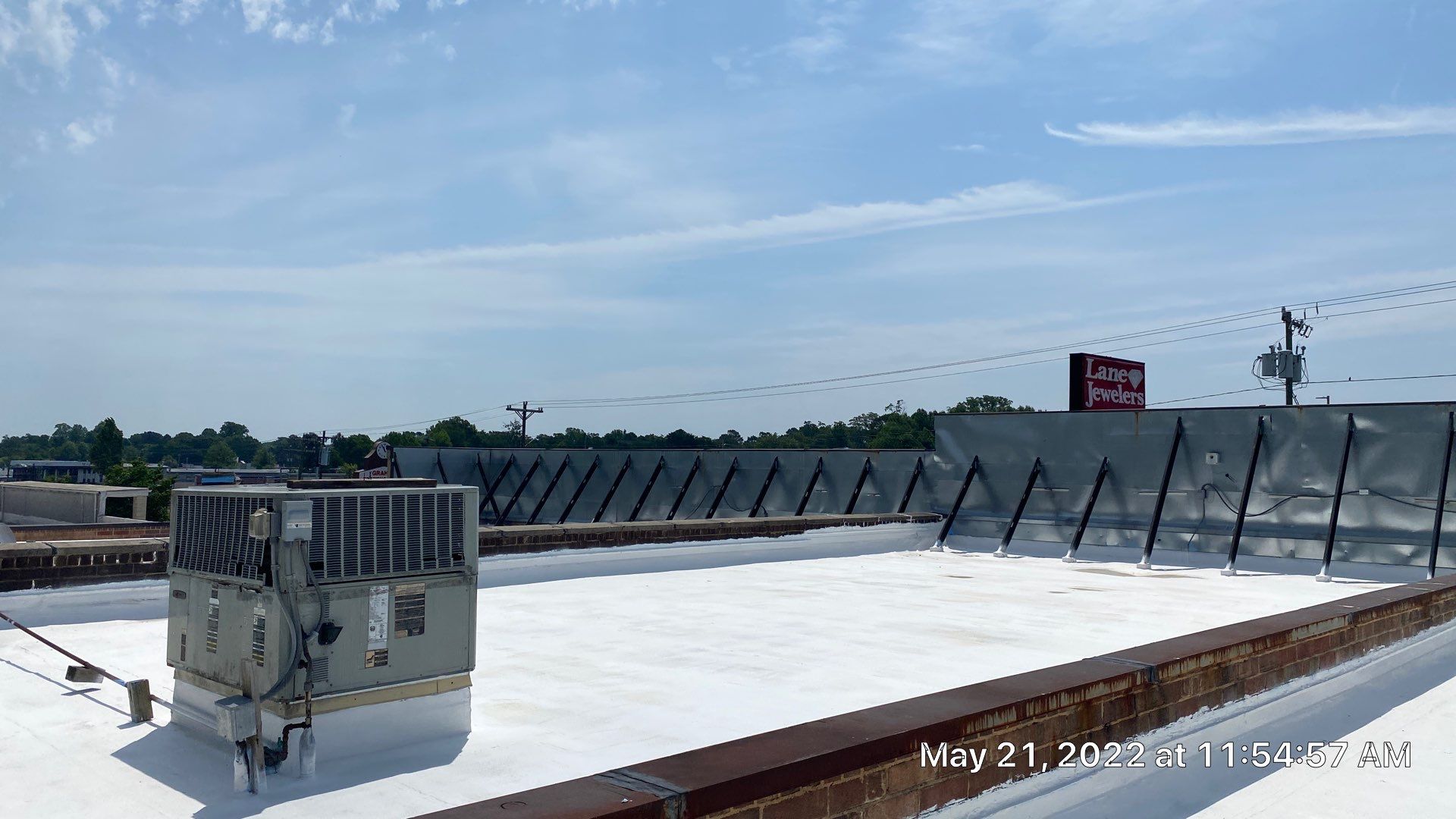 Commercial Roof Coating using Fiberseal basecoat and Silicon Topcoat by Just In Time Roofing and Restoration
