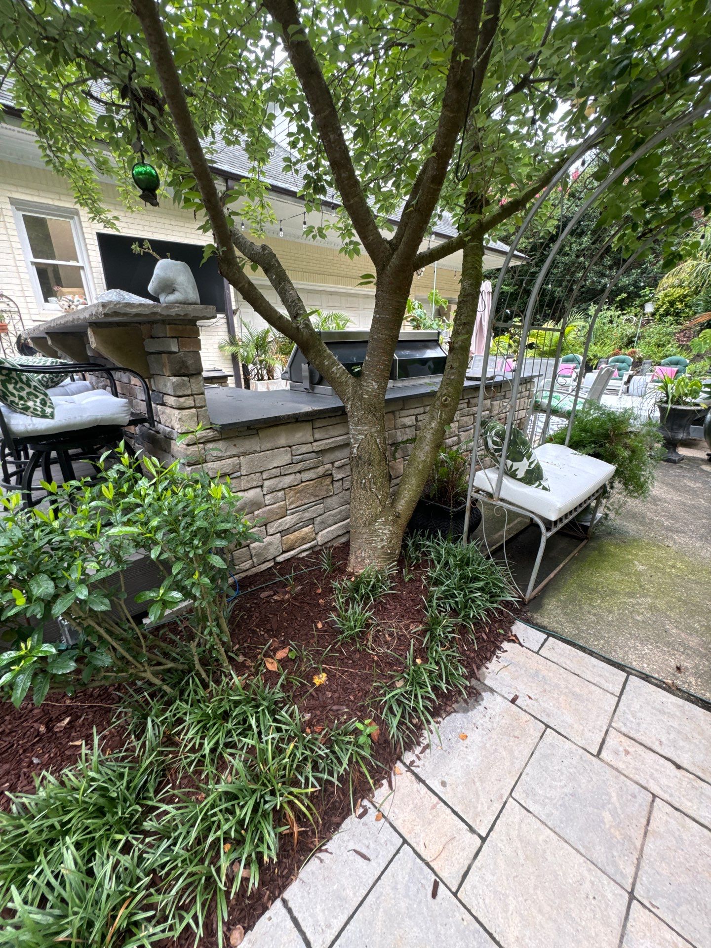 New Deck, Stone Fountain Feature, Circle Stone Sitting Area with Fireplace by The Remodeling Company