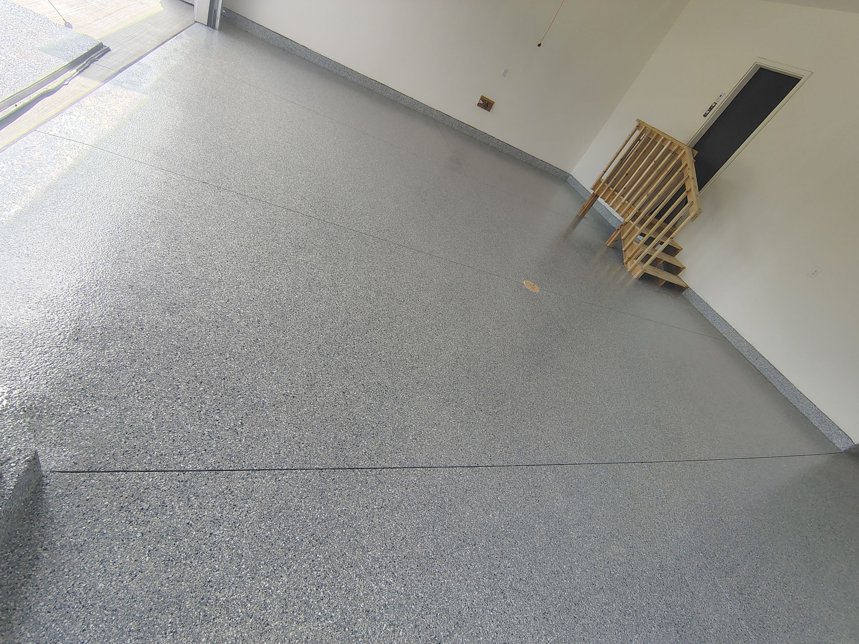 Sioux Falls Garage Floor Transformation with Gray Decorative Flake Coating by Select Painting, Coatings & Garage Cabinets
