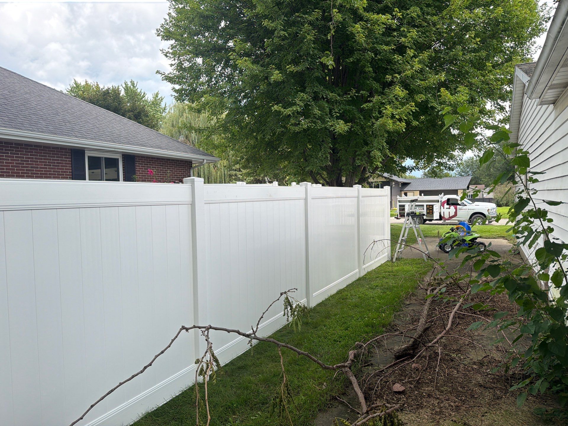 Residential White Vinyl Privacy and Black Chain Link Fencing in Jesup by Perfect Picket Fence and Stain
