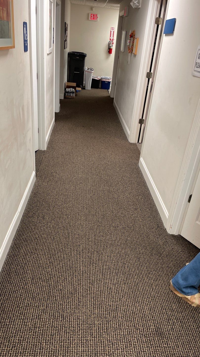 Office Remodel from Worn Out Carpet to Sleek Glued Down LVP by Footprints Floors of Coastal Carolina