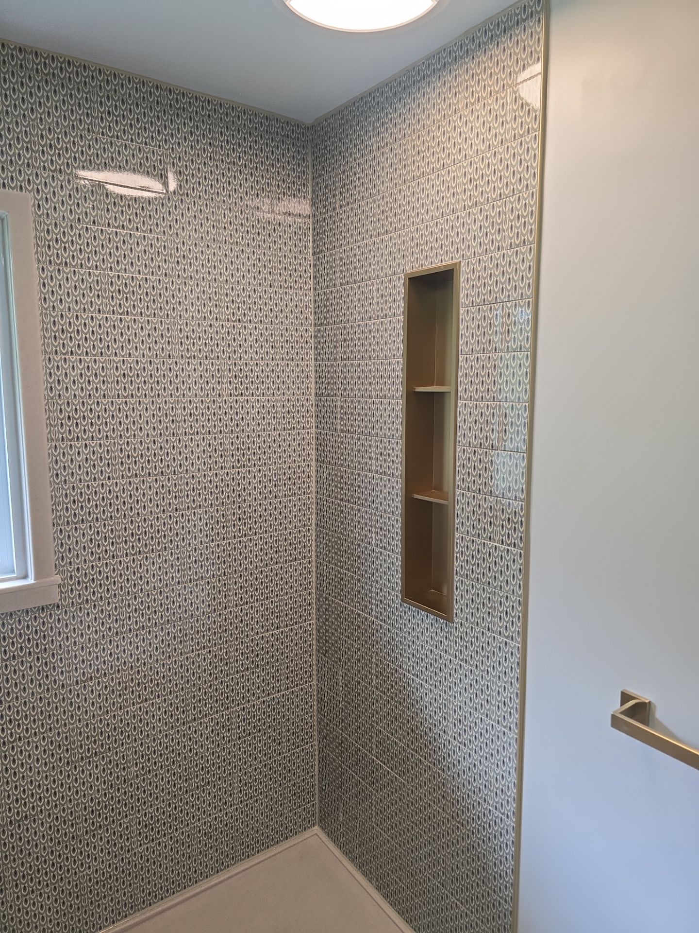 Full bathroom with custom tile by The Shower Company
