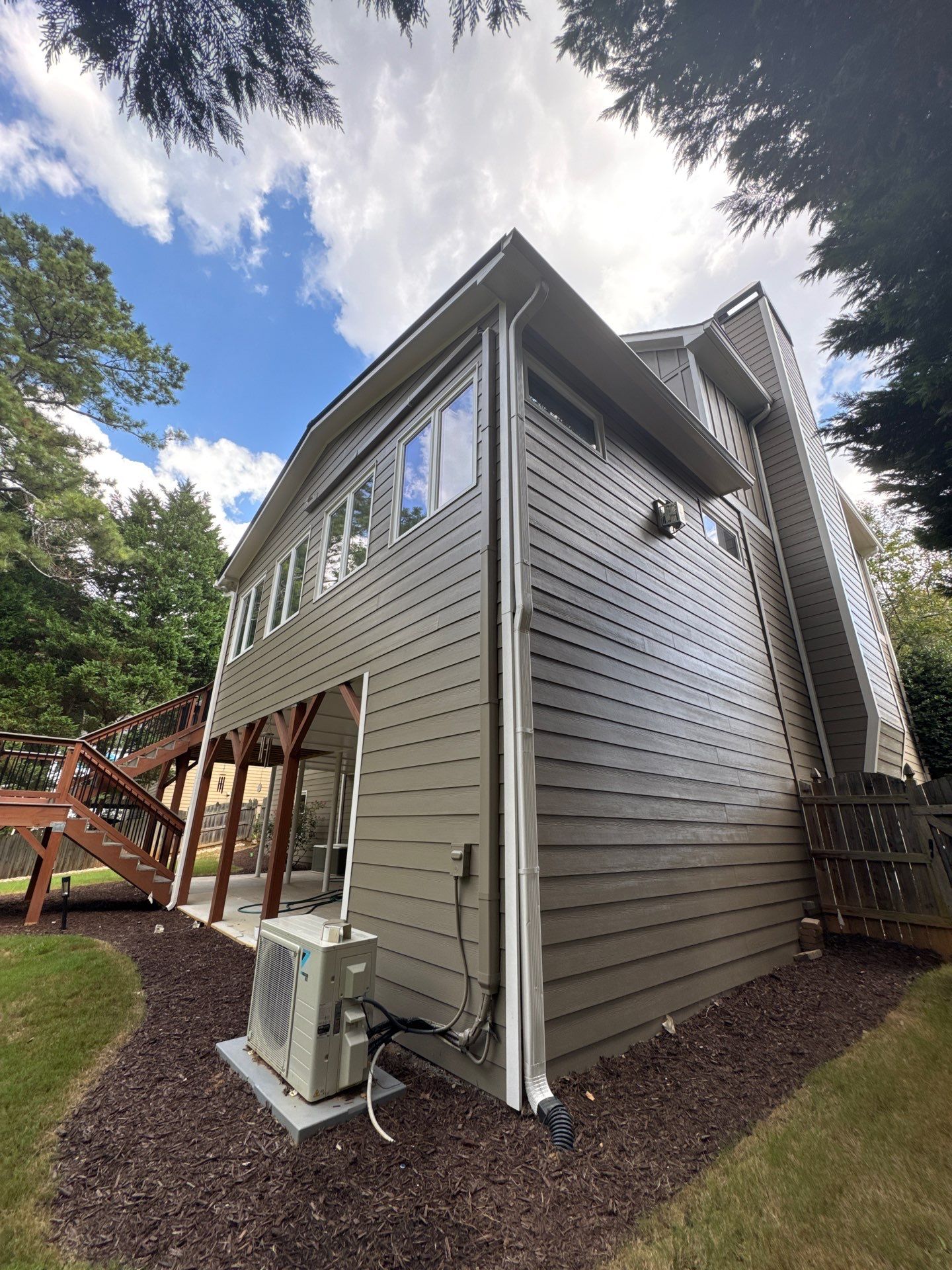 Exterior Modernization Featuring New Siding and Custom Wood Portico by Swift Home Renovations