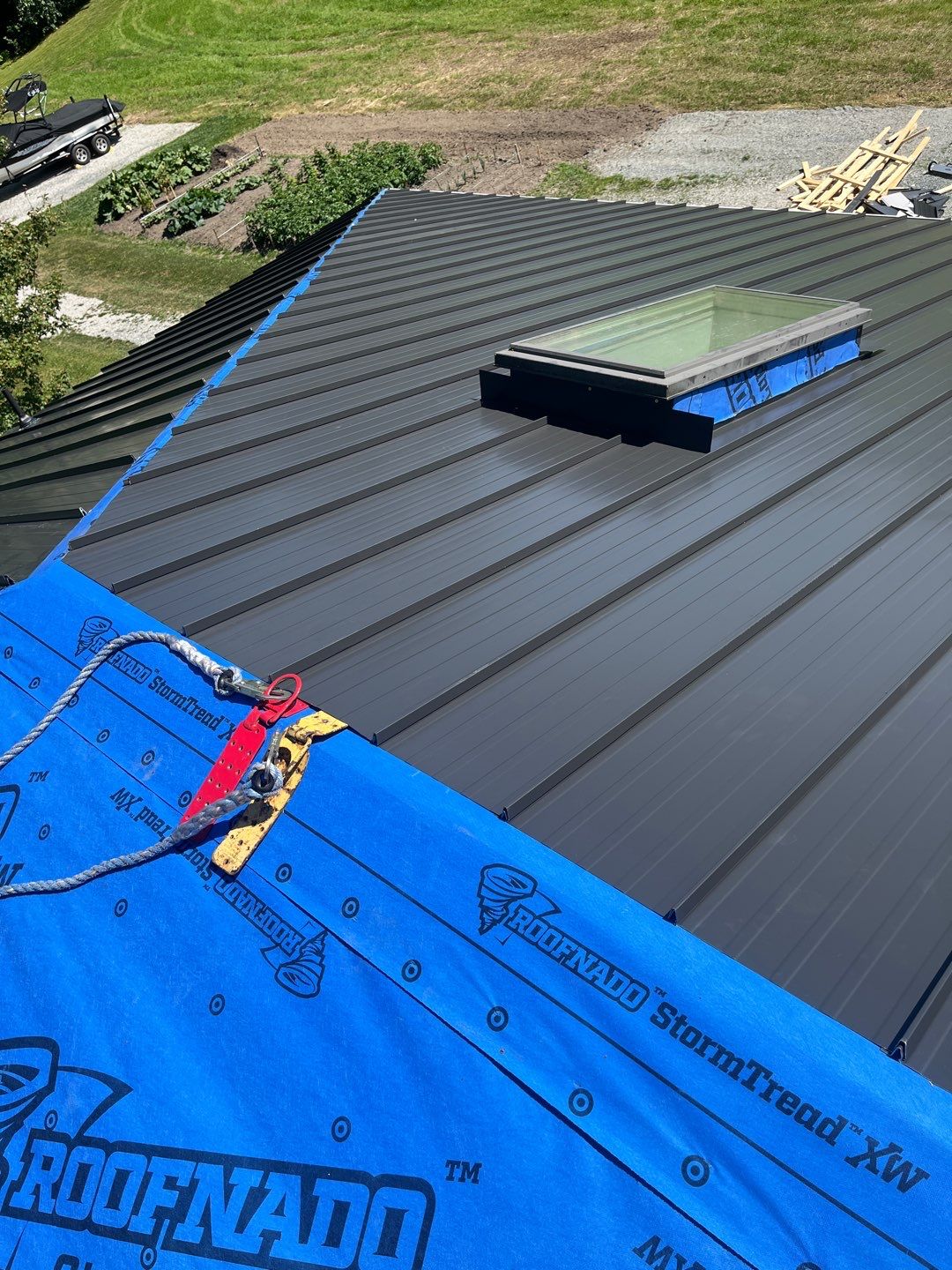 Residential Roofing Installation using 12" Prolok metal  by Top Notch Roofing Inc