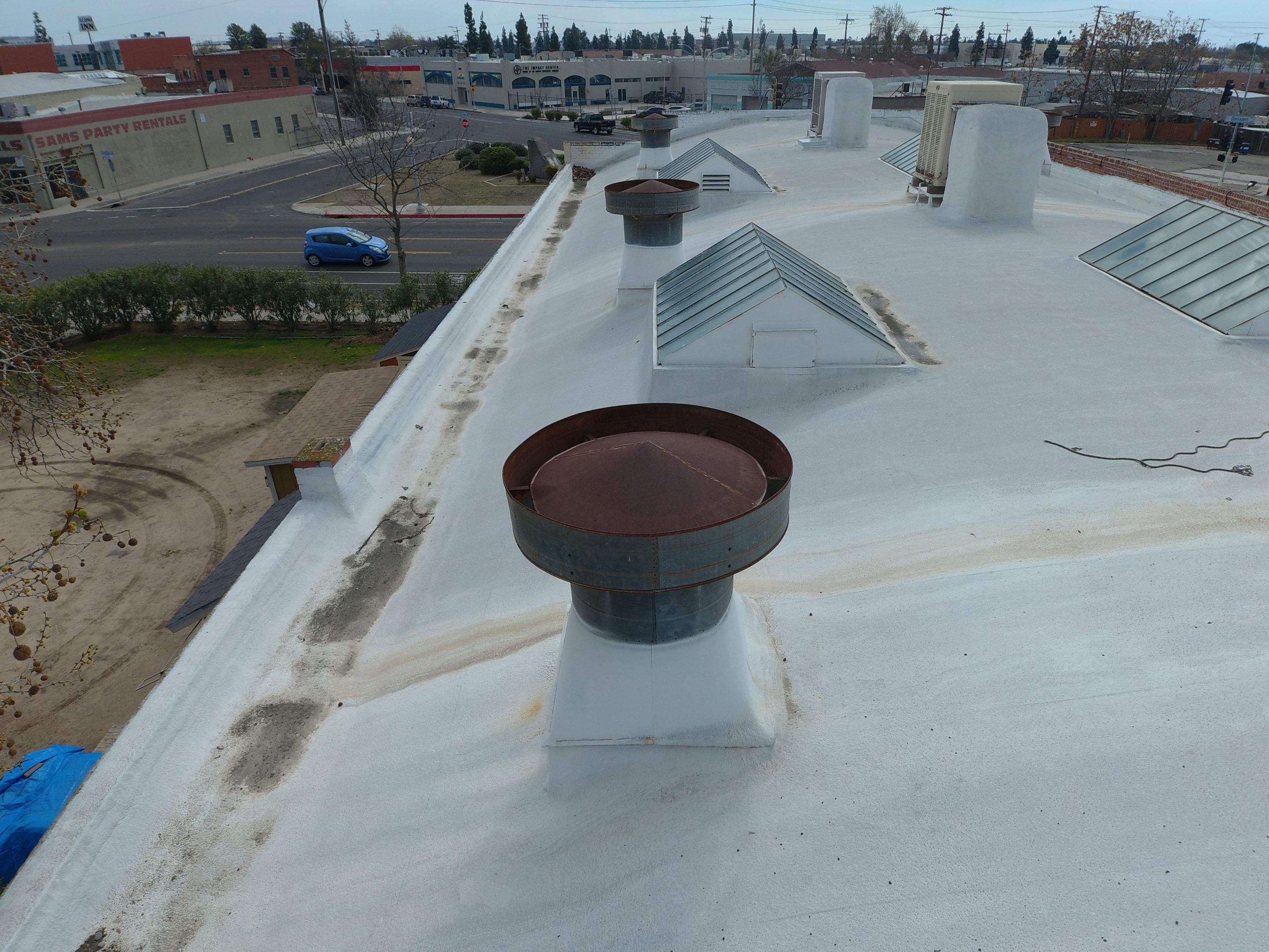 Polyurethane foam roof refurbish and recoating by Straight Edge Roofing Inc