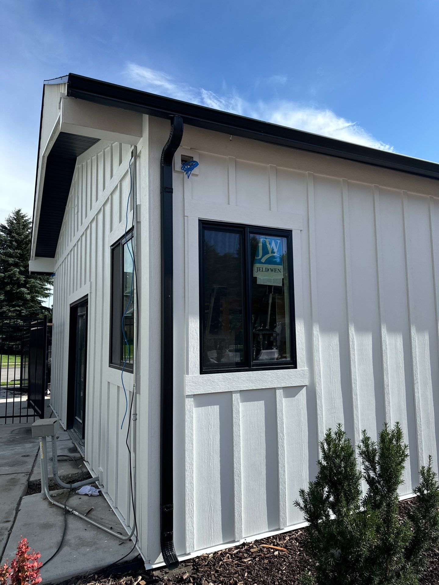 Highland | Modern Farmhouse Board & Batten | Arctic White & Black by Ideal Siding Utah