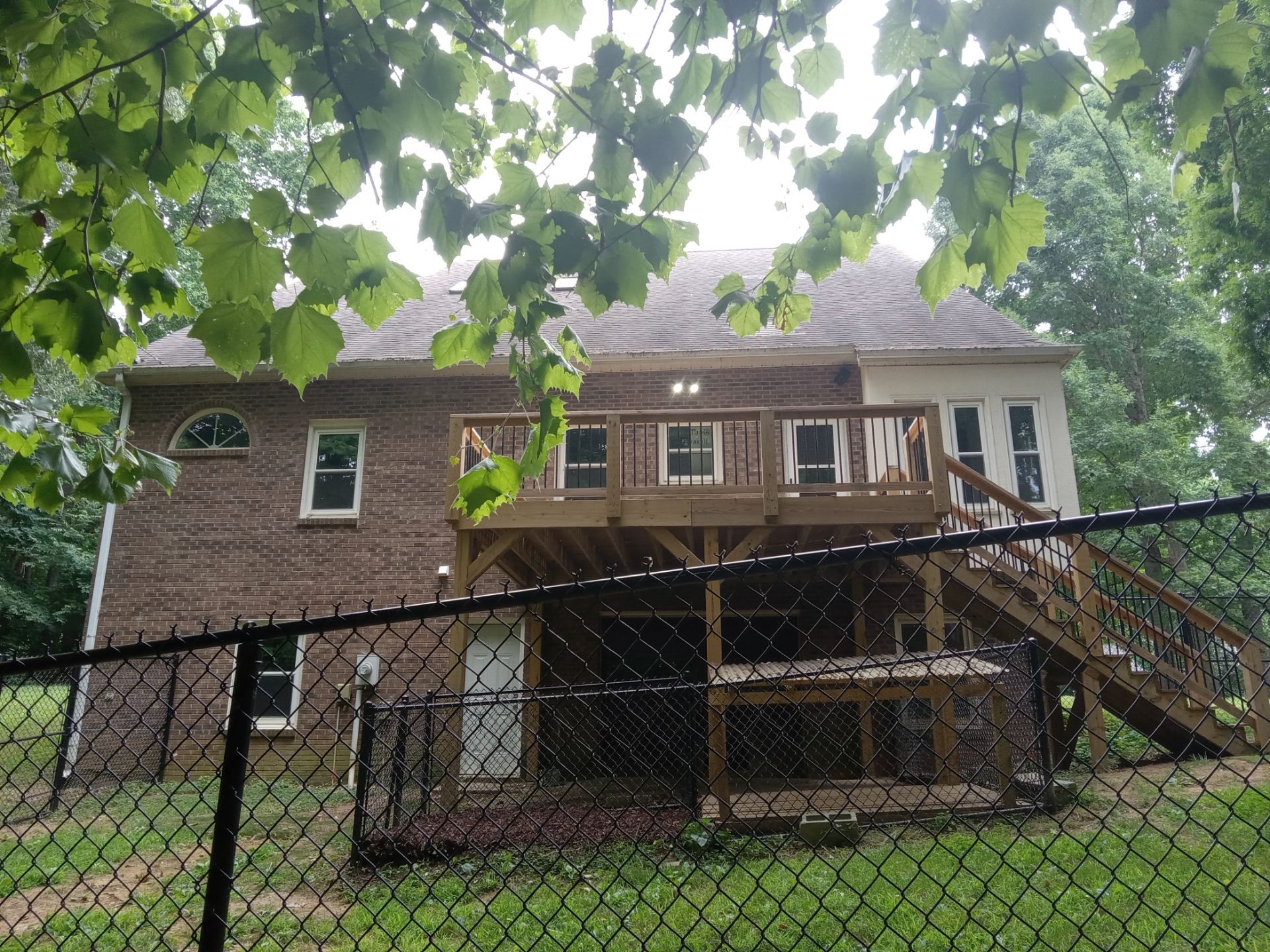 the service being done by the pressure washing company could include cleaning the exterior brick facade of the house, the vinyl siding, and the wooden deck along with the stairway leading up to the deck the pressure washing could remove dirt, grime, mildew, and other build-up from these surfaces leaving them clean and rejuvenated