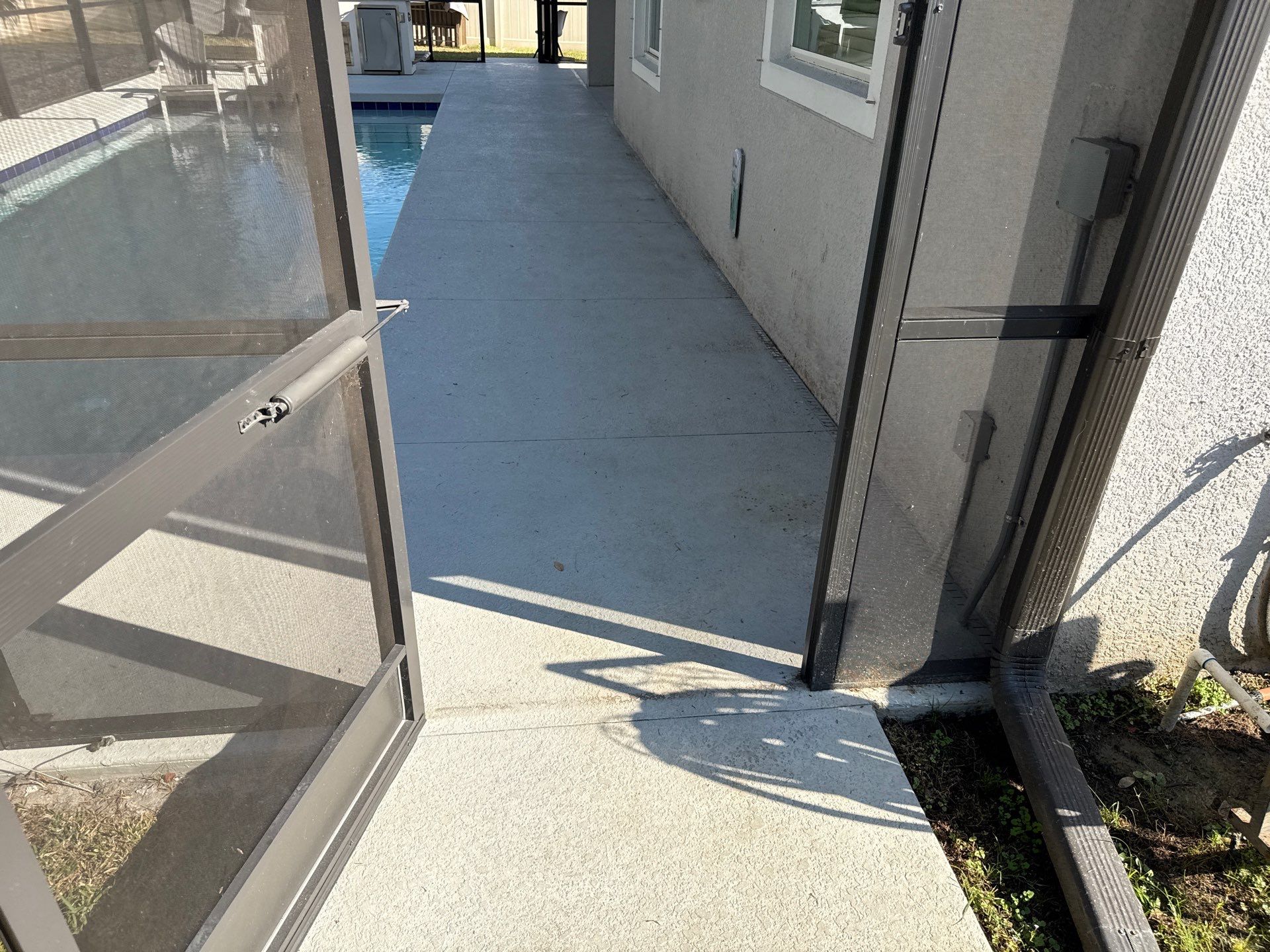 Painted Pool Deck & Screen Enclosure Cleaning | Heron Creek, Palmetto FL by Sunshine AquaWash