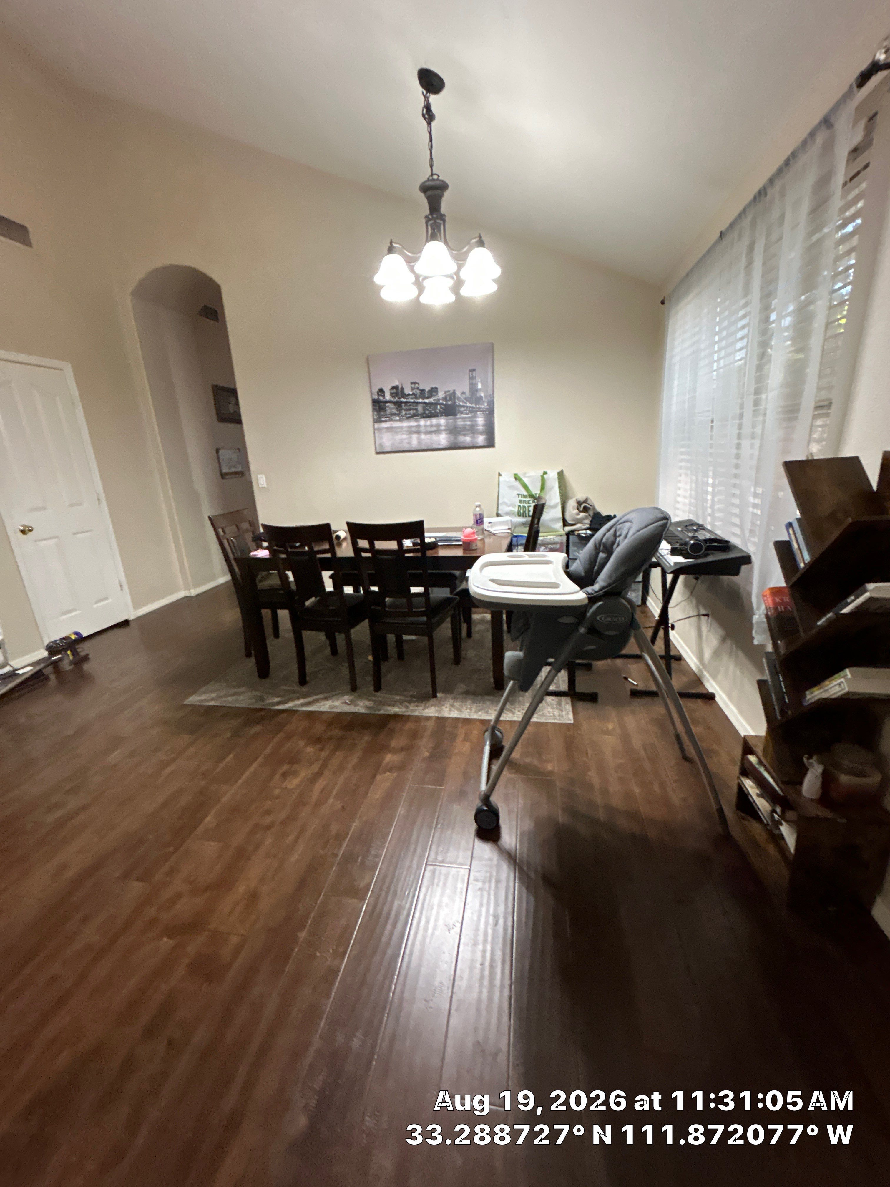 Dark Wood Laminate Flooring Installation for Chandler Dining Room by CompanyCam Sales Demo