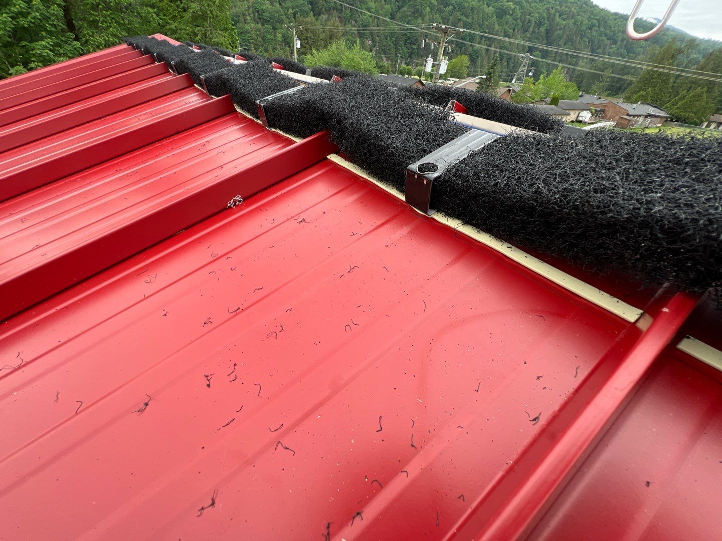 Commercial Roofing Installation using 12" Prolok metal  by Top Notch Roofing Inc