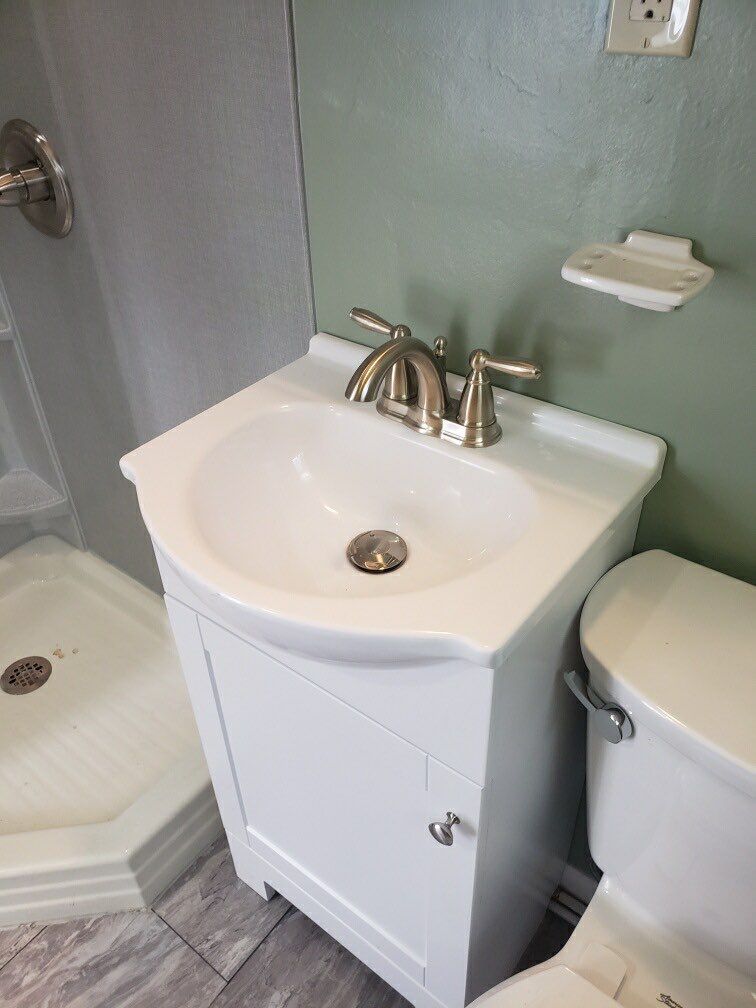 Bathroom Remodel using BCI Acrylic Shower System by Secure Construction Company Inc