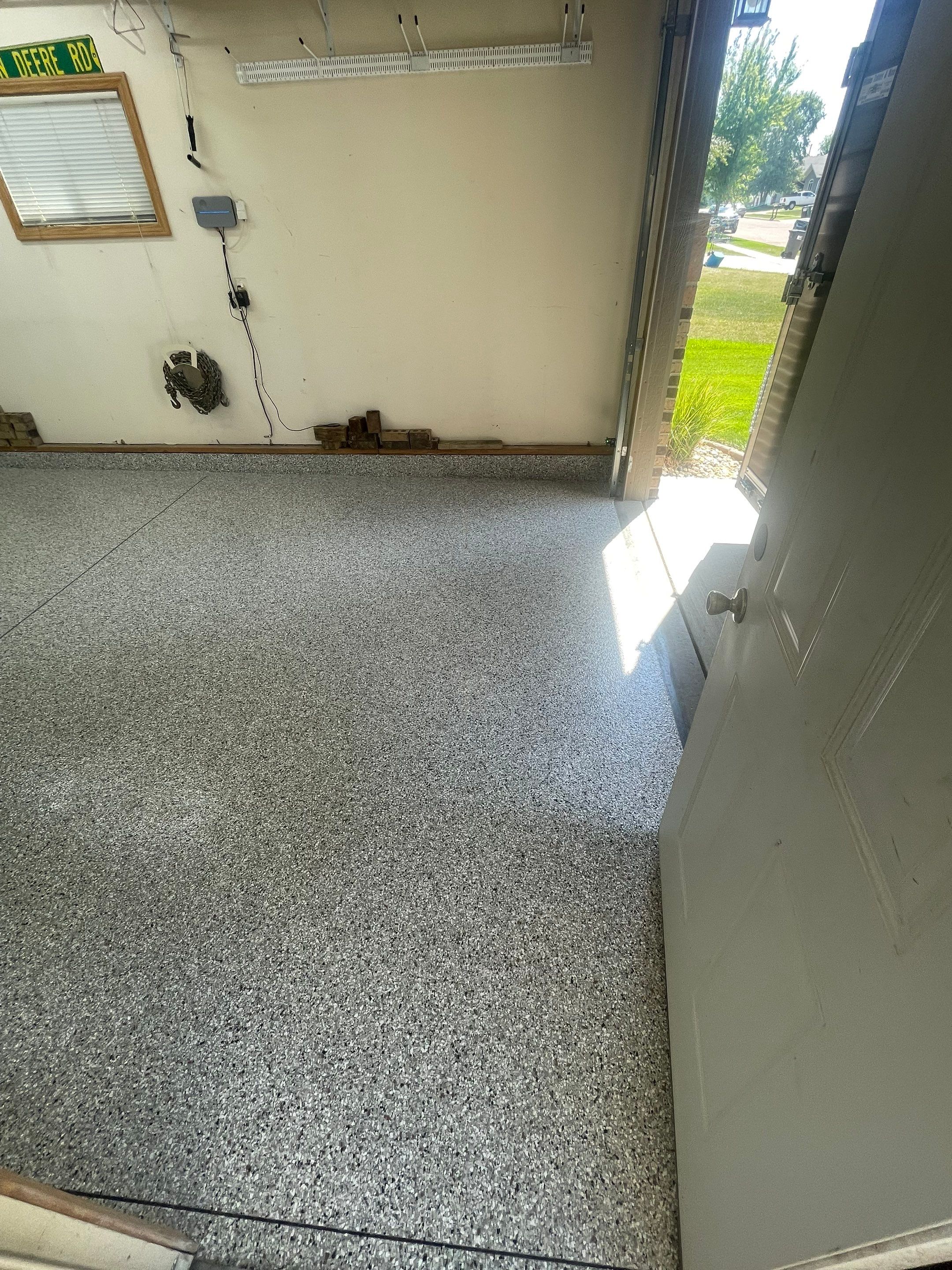 Multi-Stall Garage Floor Coating Installation in Sioux Falls by Select Painting, Coatings & Garage Cabinets