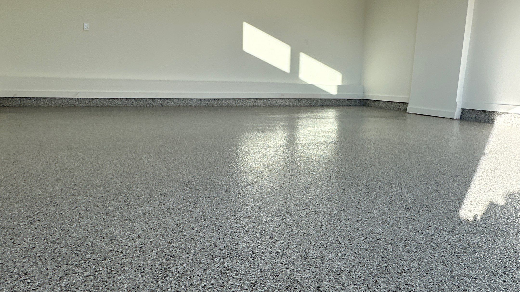 Mike M. got him self a beautiful Coyote flake floor by Banner Garage