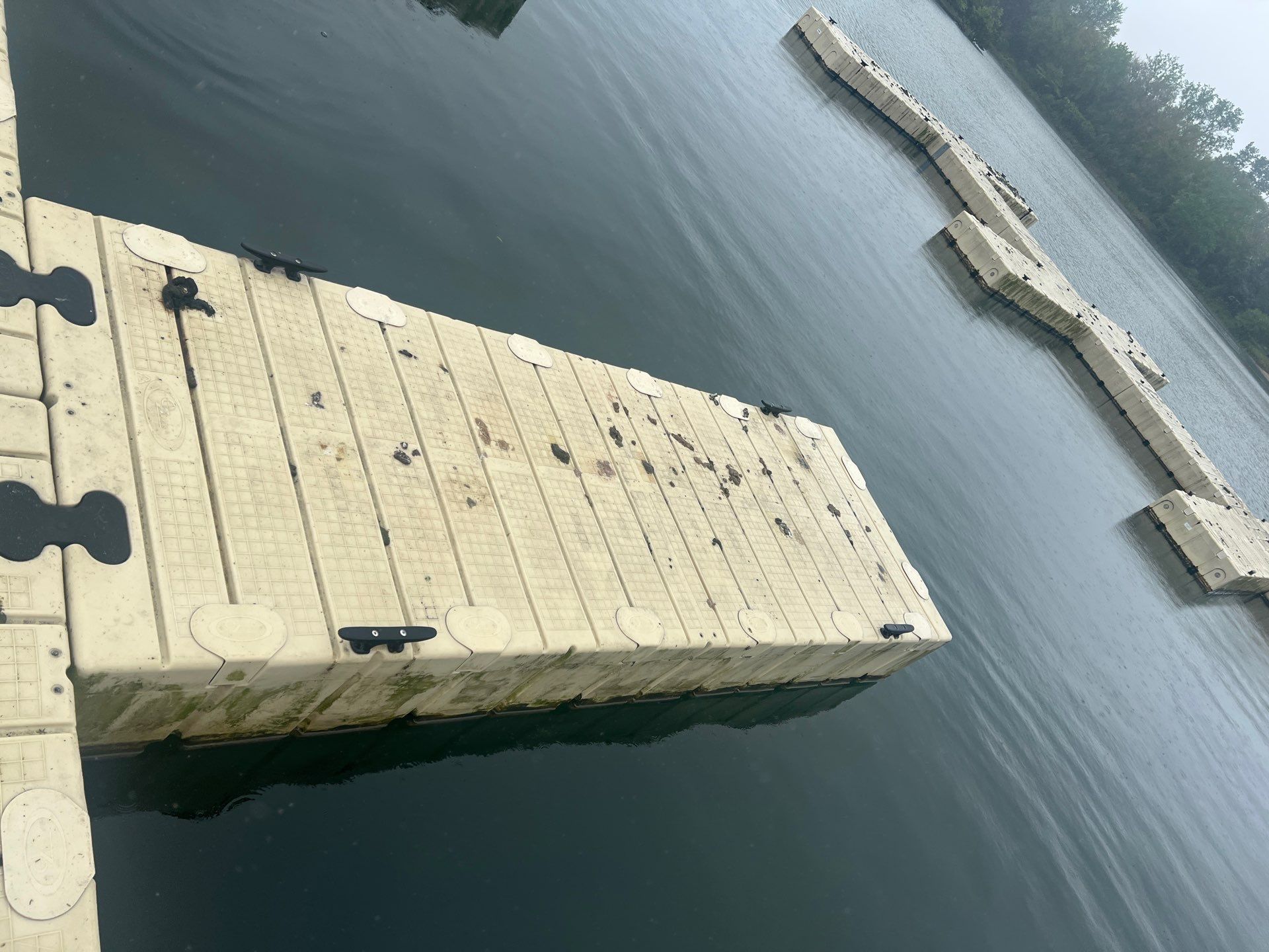 Power washing of floating dock by Northern Power Washing LLC.