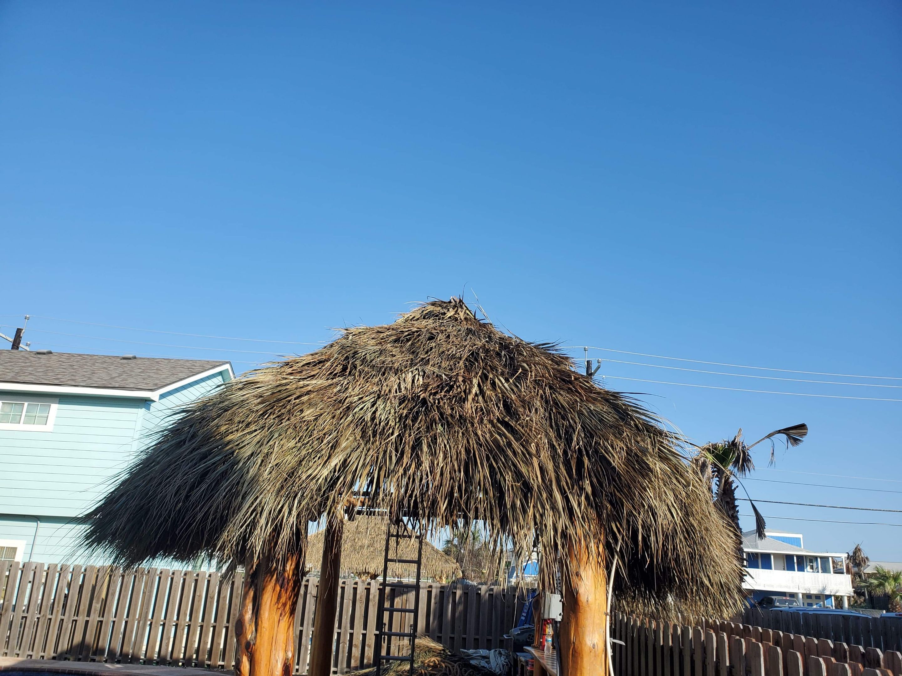 Poolside paradise by Bayfront Roofing and Construction