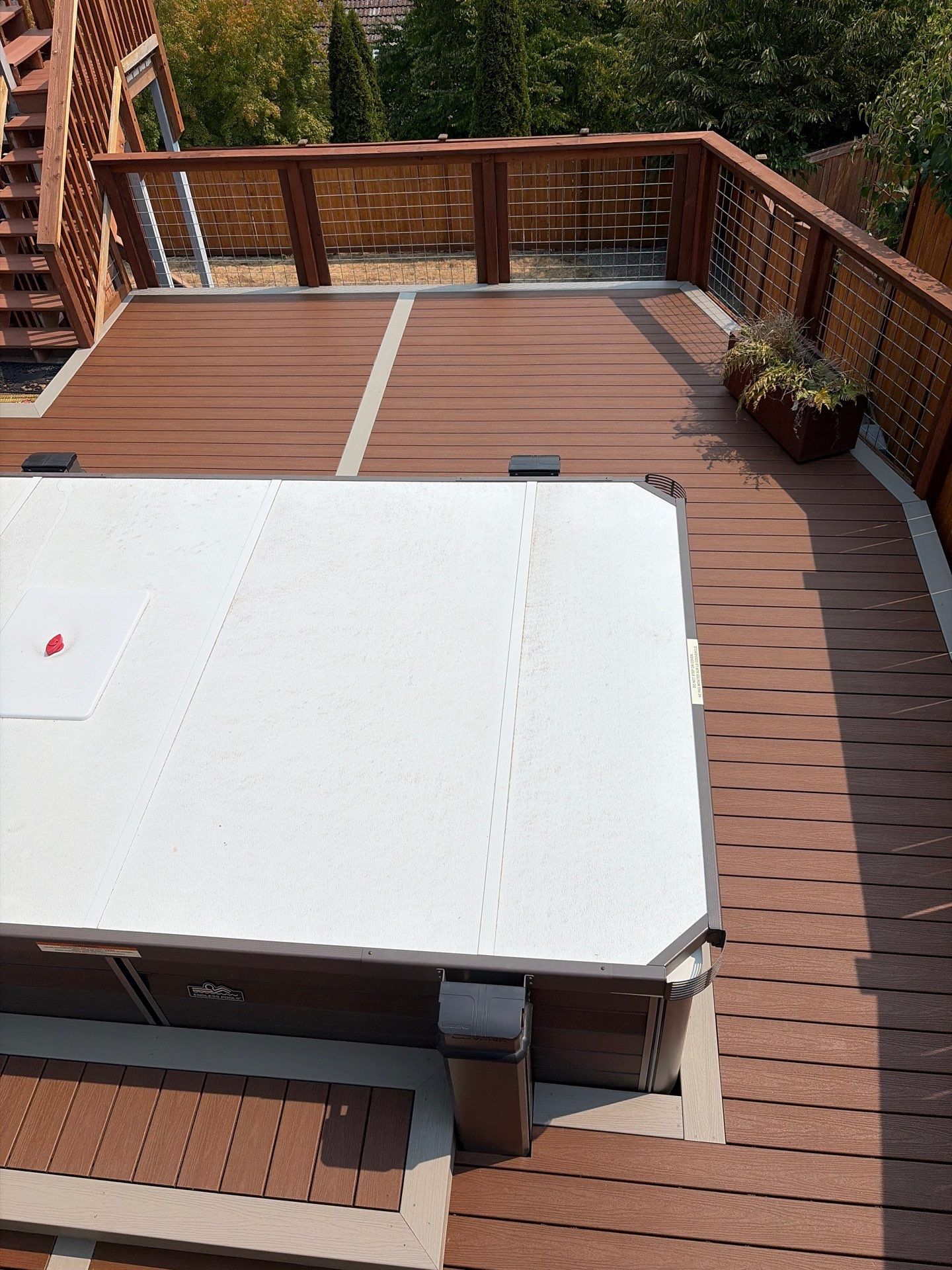 Tacoma Custom Composite Deck and Hot Tub Surround with Retaining Wall by Emerald City Energy 