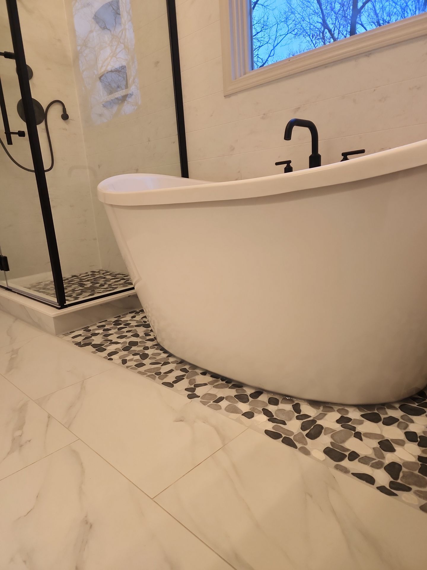 Beautiful use of many materials by The Shower Company