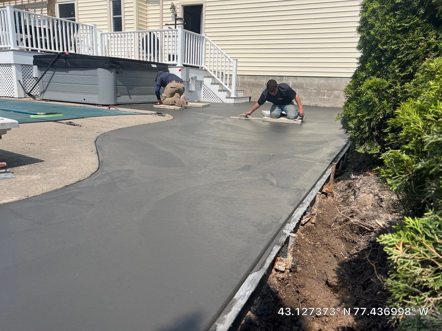 Bluestone stamped concrete patio  by NG Masonry & Construction LLC