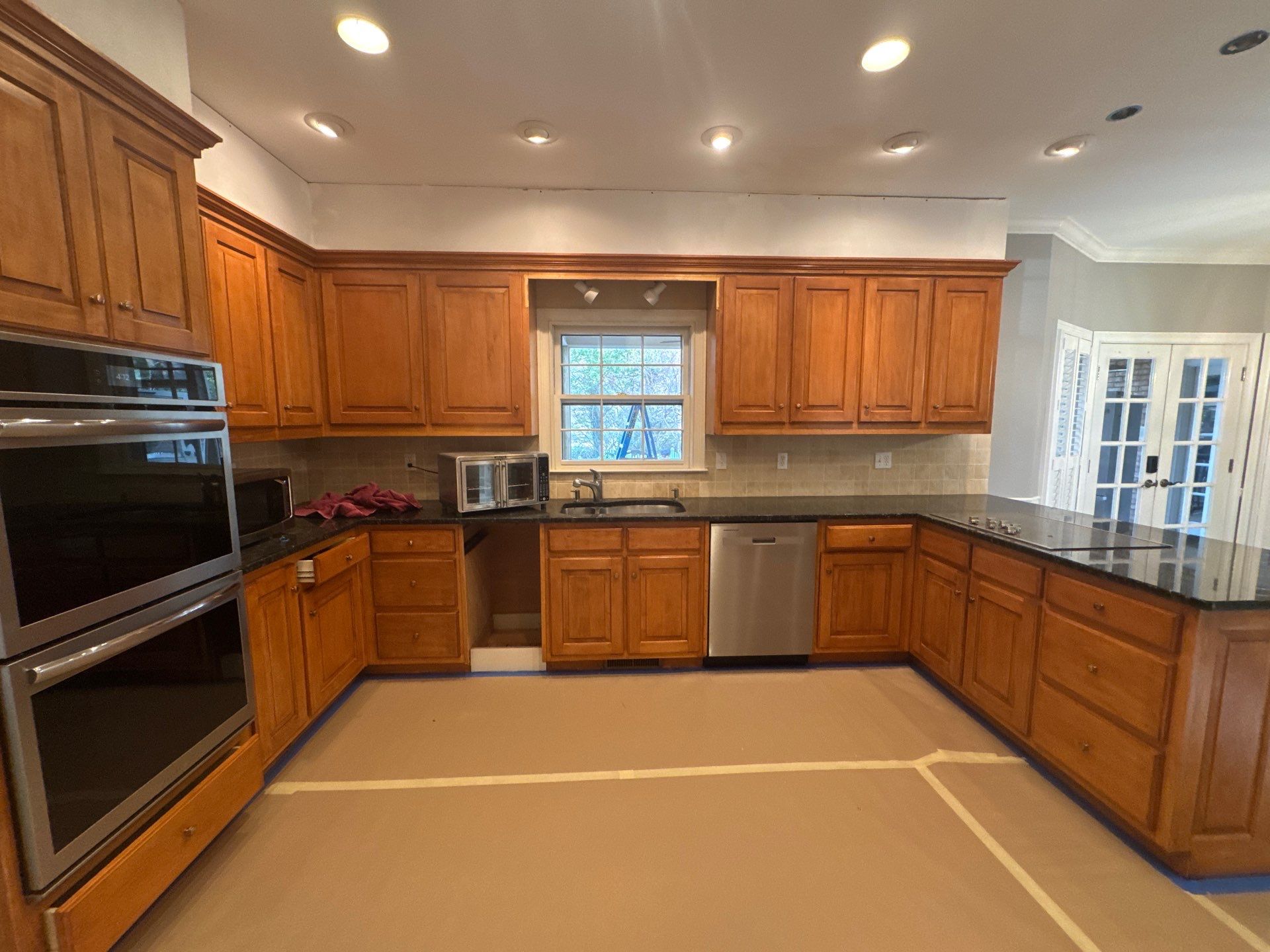 Dark Walnut Hardwood Floor Refinishing and Cabinet Painting in Atlanta by Swift Home Renovations