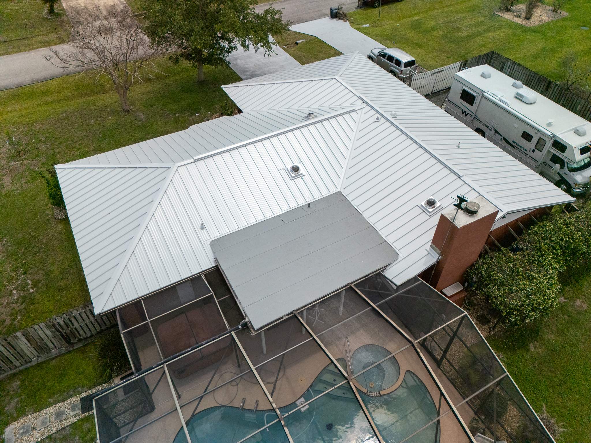White Standing Seam Metal Roof Replacement and Hurricane Reinforcement in Palm Bay, Florida by Wiedmann Construction & Roofing