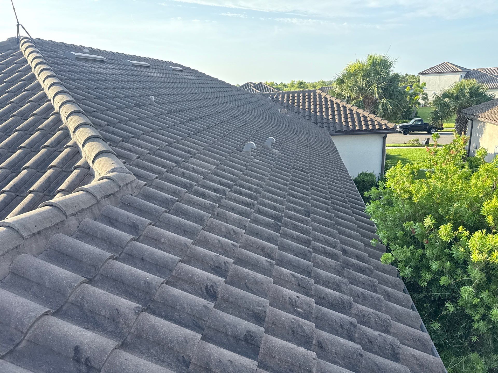 Soft Wash Roof Cleaning – Concrete Tile Roof | Artisan Lakes Esplanade, Palmetto, FL by Sunshine AquaWash