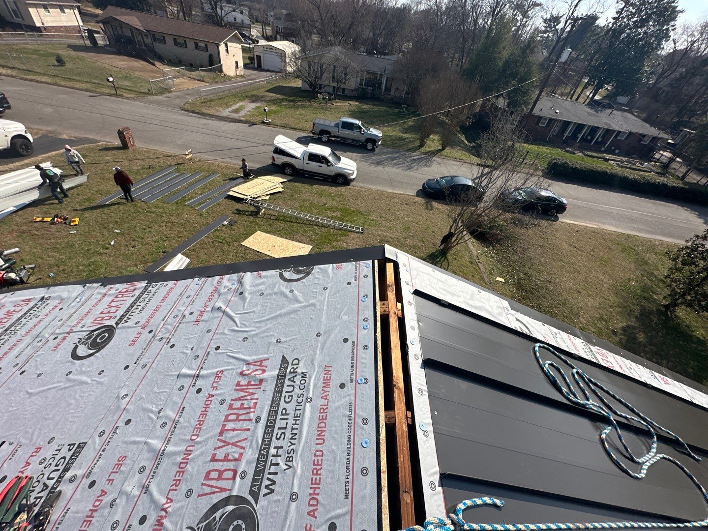 Residential Roofing Installation using Standing Seam Metal by Undersun Roofing 