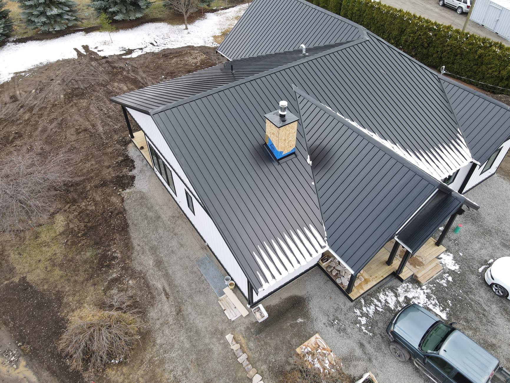 Residential Roofing Installation using 12" Prolok metal  by Top Notch Roofing Inc