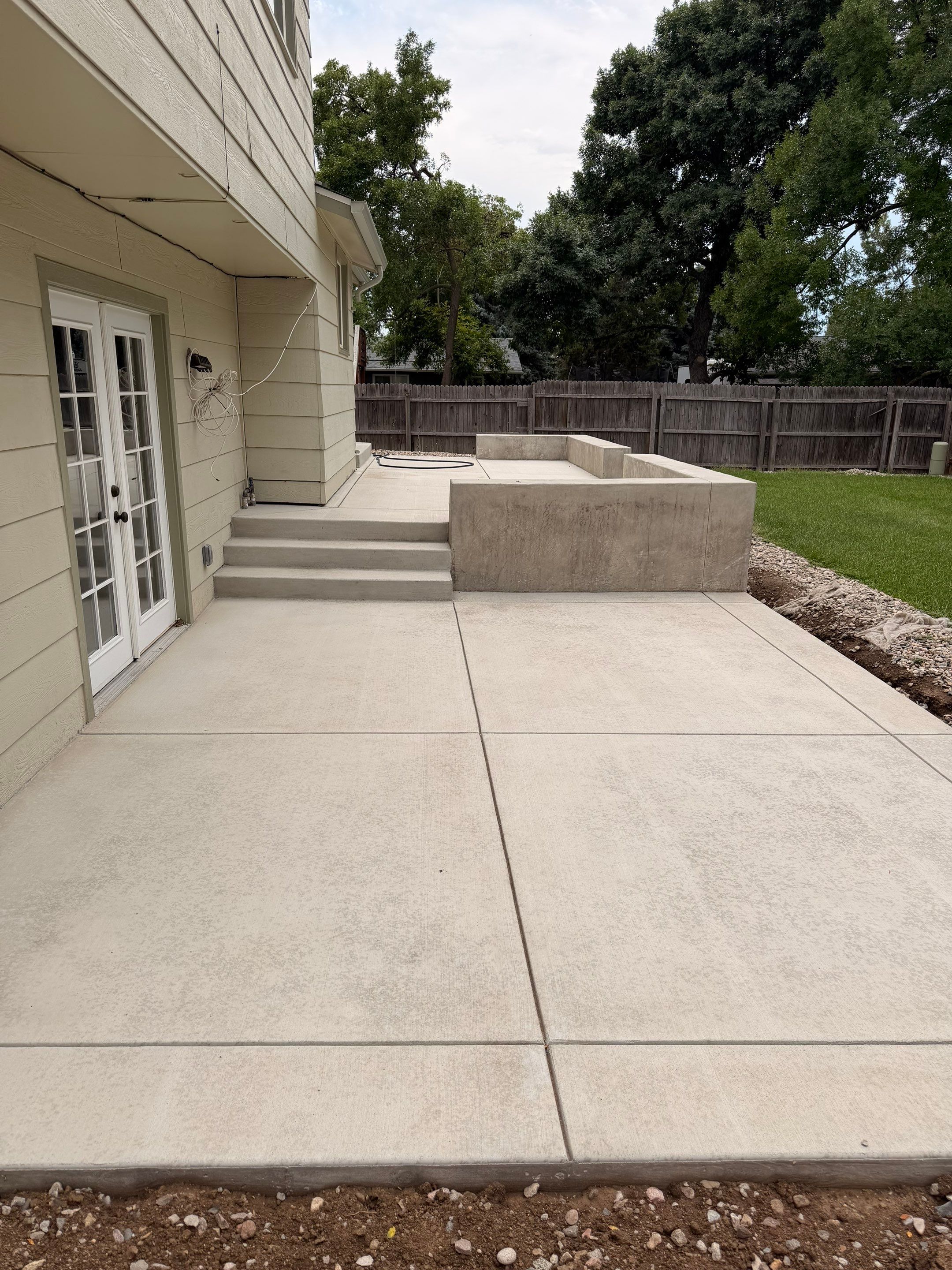 New Concrete Patio and Integrated Retaining Walls in Fort Collins by Center Line Concrete