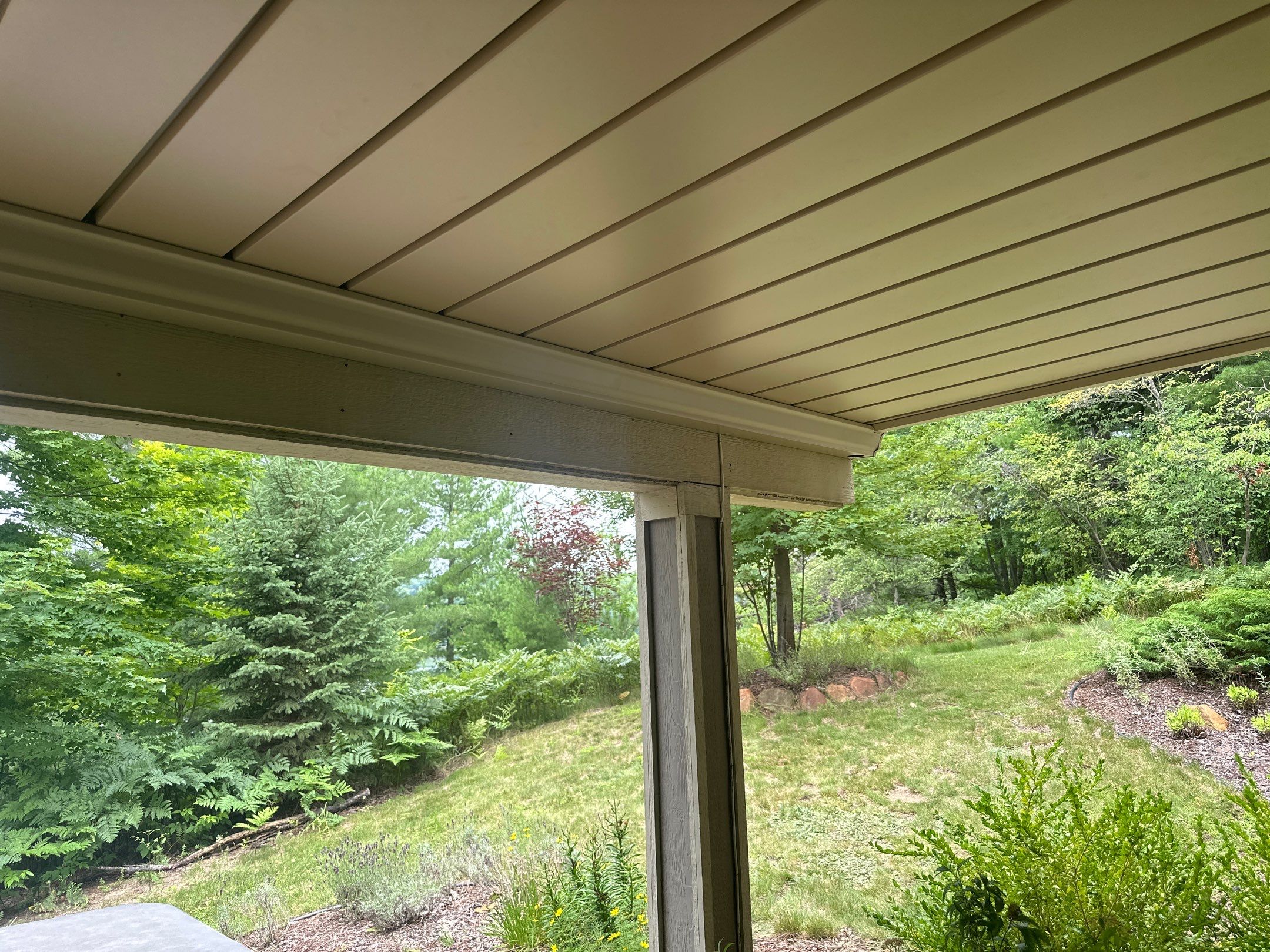 Traverse City Underdecking Installation with Integrated Seamless Gutter System by Rainbow Seamless Systems