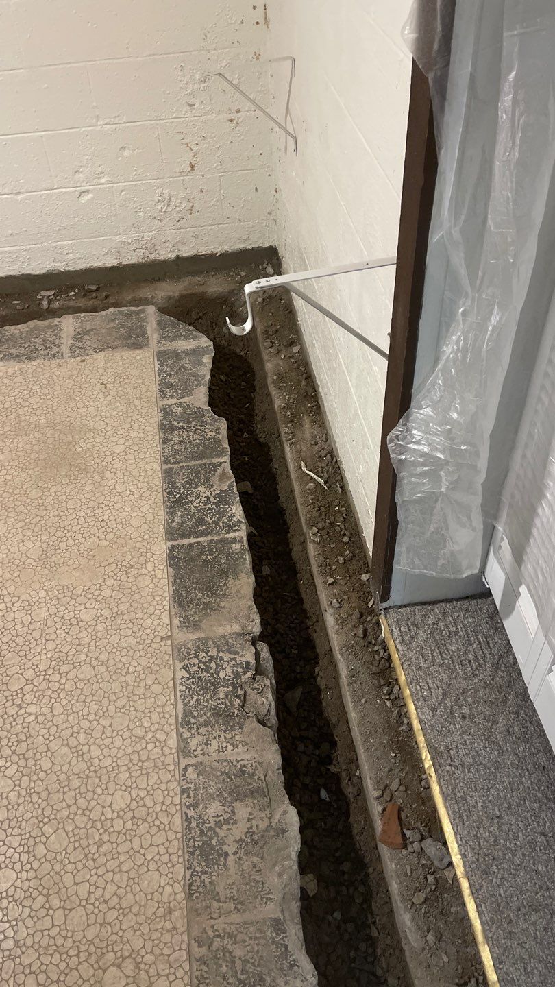 Interior Waterproofing Using GrateDrain™ Products by Toledo Basement Repair 