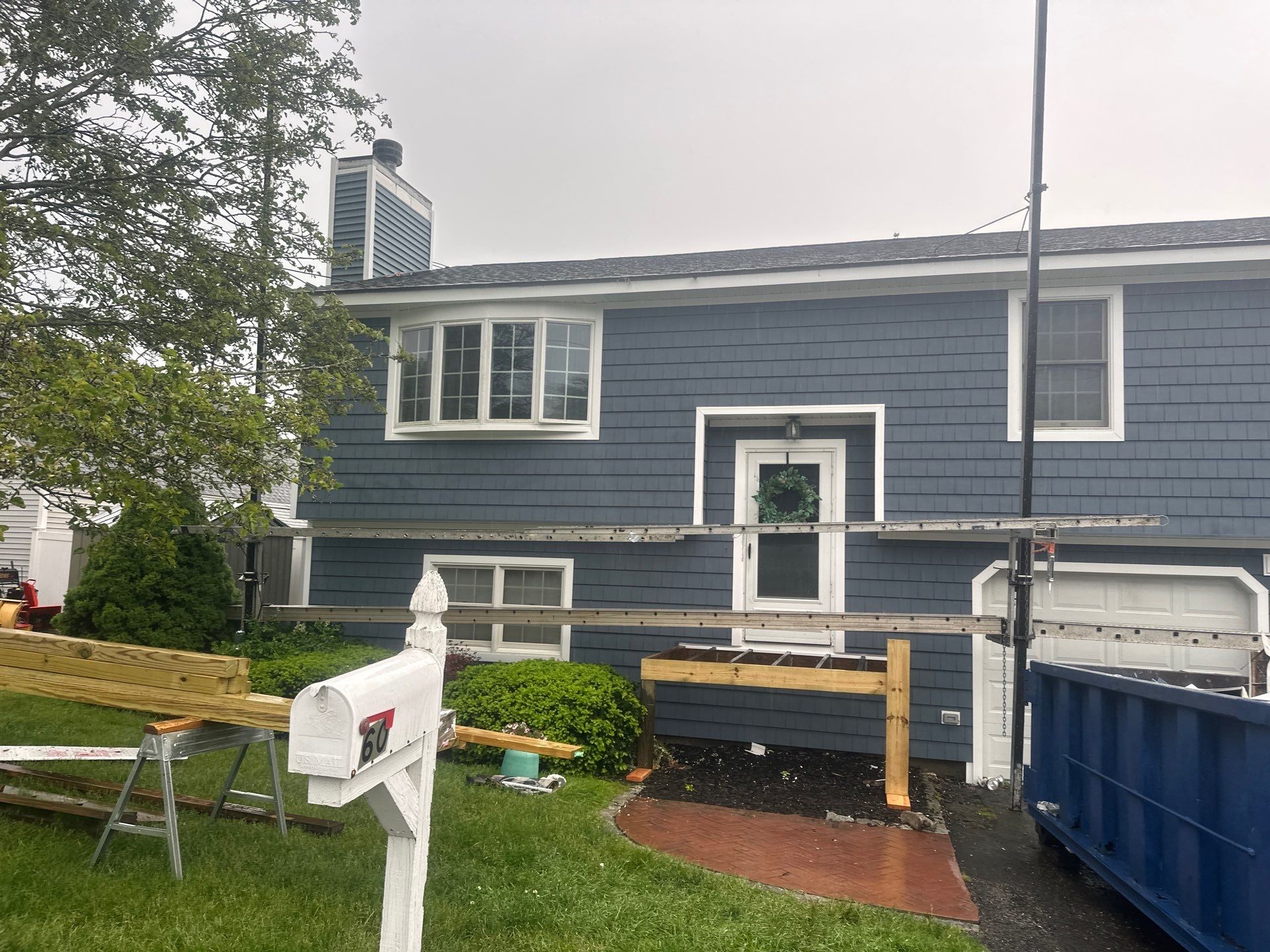 Siding Installation using Certainteed Cedar Impressions Straight Edge Perfection Shingles - D7 - Pacific Blue by A Plus Exterior