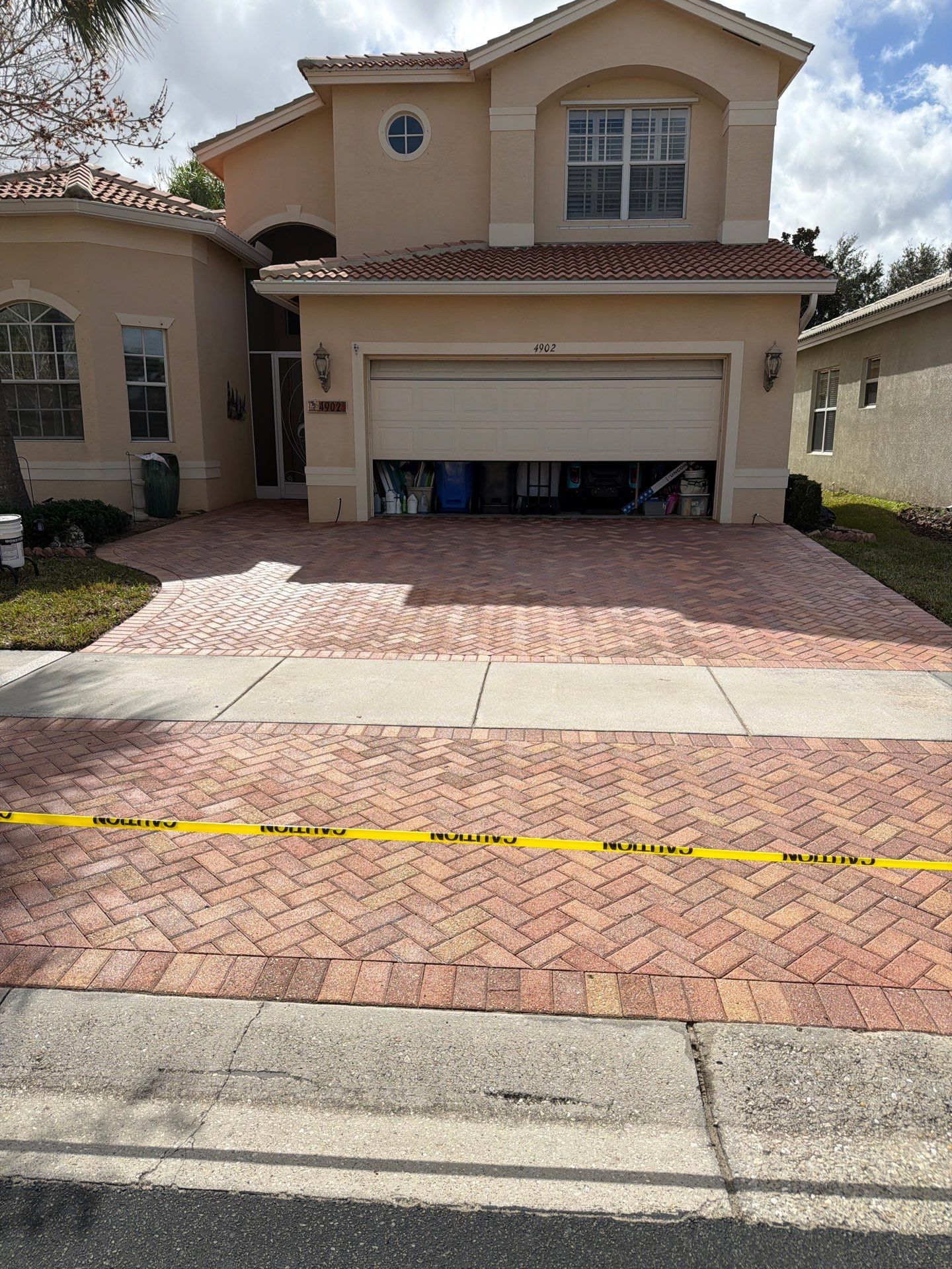 Paver Sealing for Herringbone Driveway and Screened Lanai in Valencia Lakes by Supreme Paver Experts