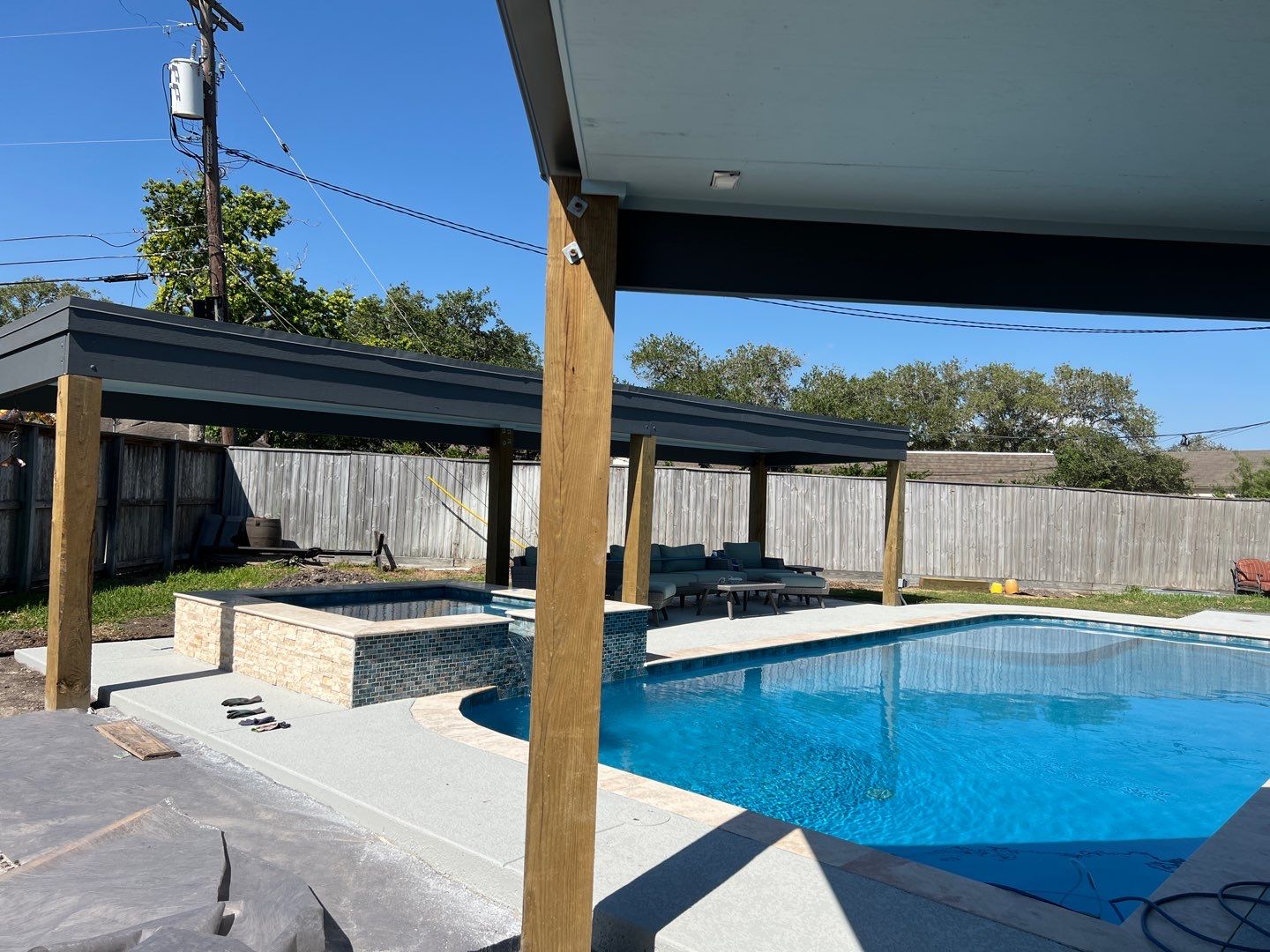 Beautiful pool side build by Bayfront Roofing and Construction