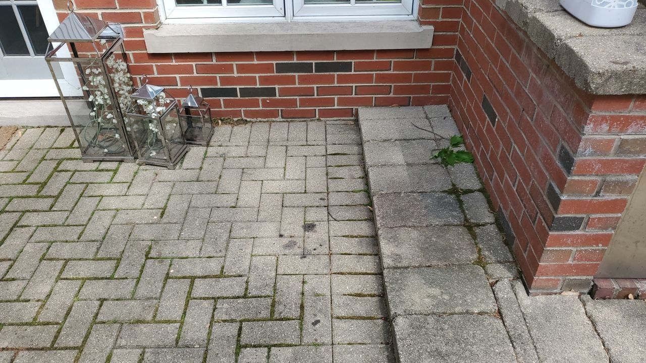 Brick patio repair, clean sand and seal by Northern Power Washing LLC.