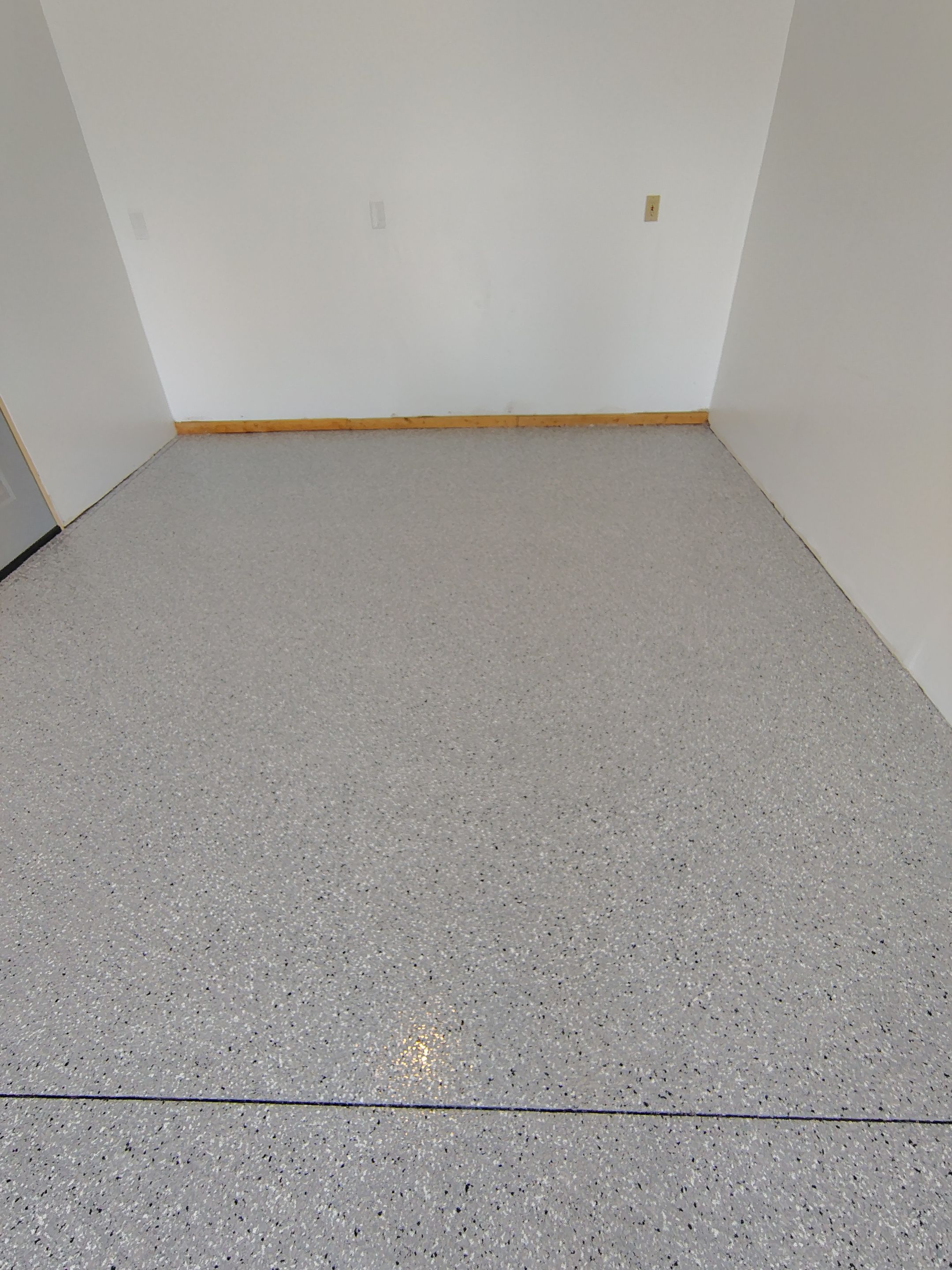 Decorative Chip Concrete Coating Installation in Luverne by Select Painting, Coatings & Garage Cabinets