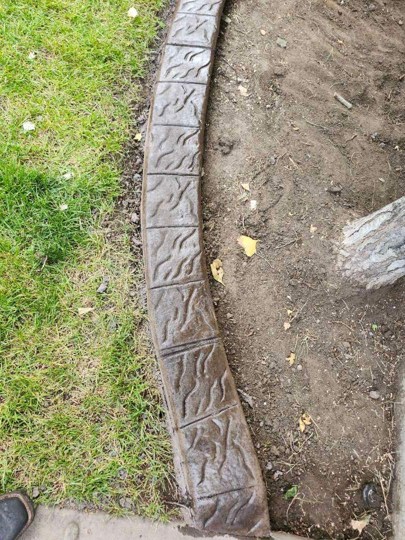 Decorative Stamped Concrete Landscape Edging Installation in Medicine Hat by Pump it Up Concrete Jacking