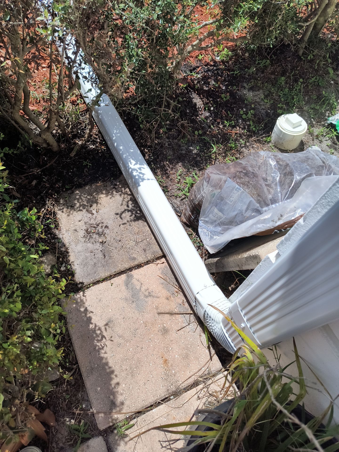 Gutter Project with White 6-K Seamless Gutters Installation and Downspouts in Sarasota FL by Gutter Professors