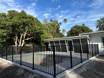 Aluminum Fence Installation using Black 3 Rail Aluminum Fence