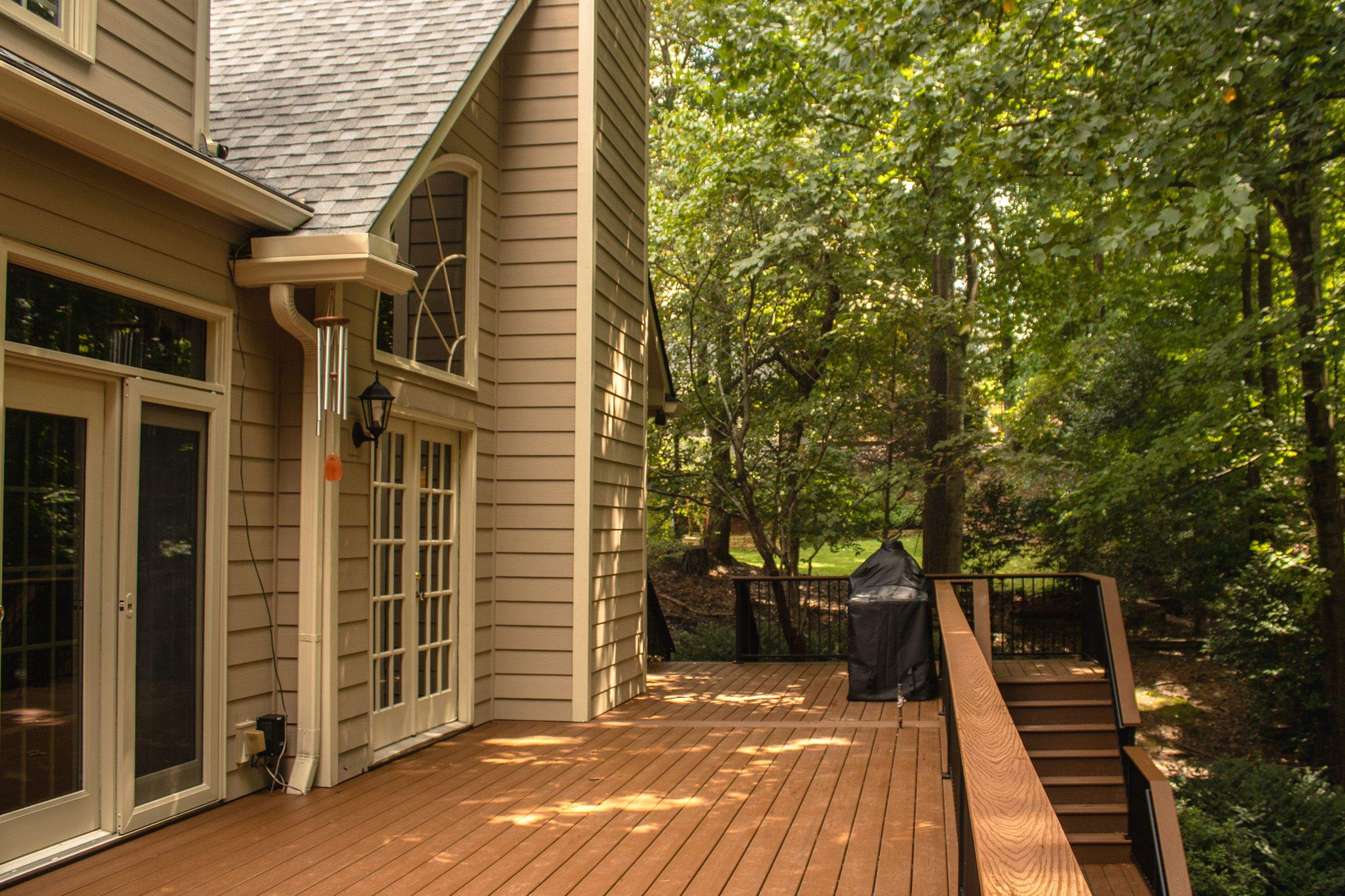 Full James Hardie Siding Replacement and Trex Deck Resurface in the Saddle Color by Nelson Exteriors 
