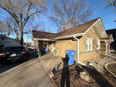 Exterior Siding Repair and Full House Repaint in Sioux Falls