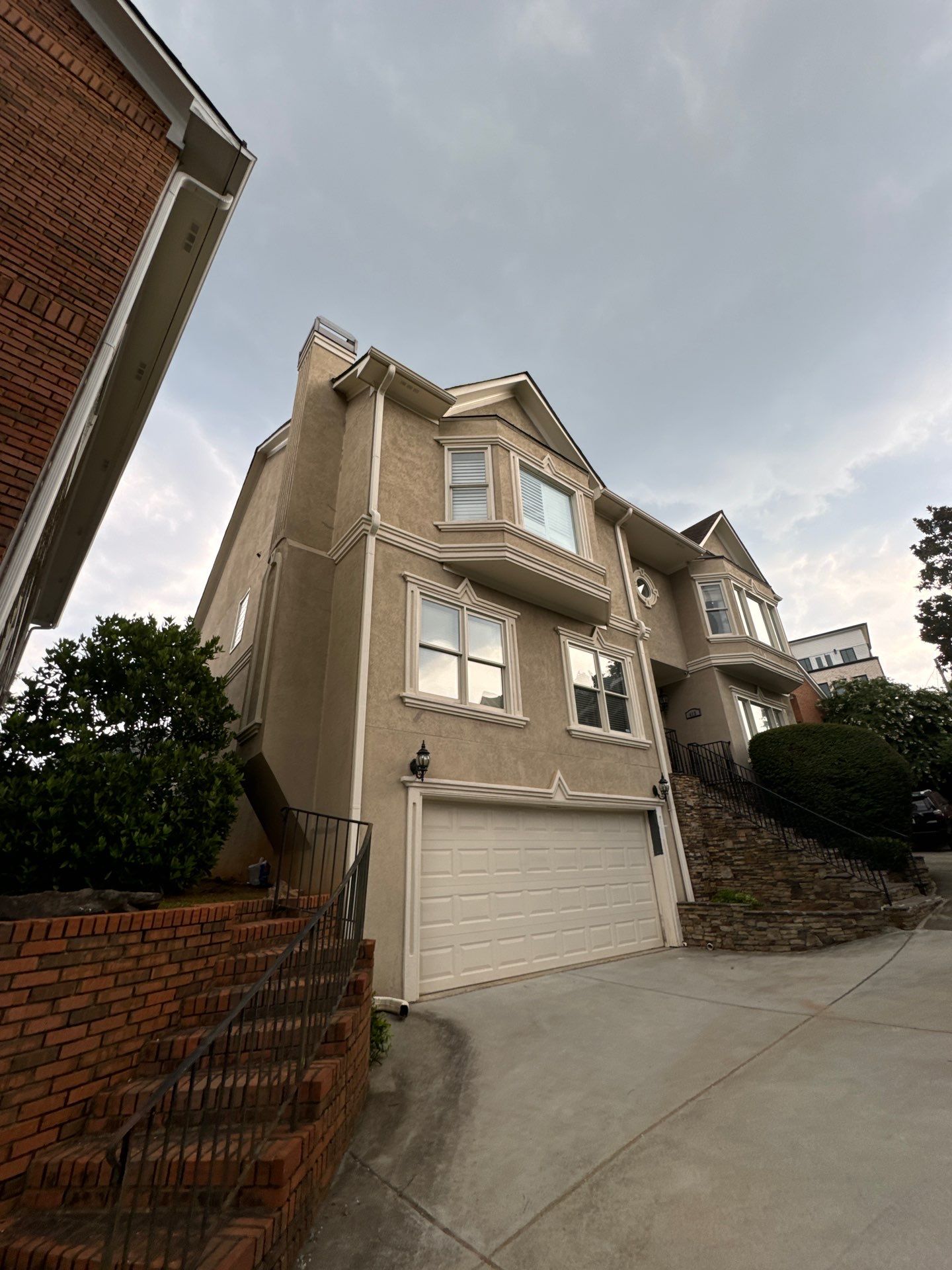 Full Exterior Stucco Painting and Wood Deck Staining in Atlanta by Swift Home Renovations