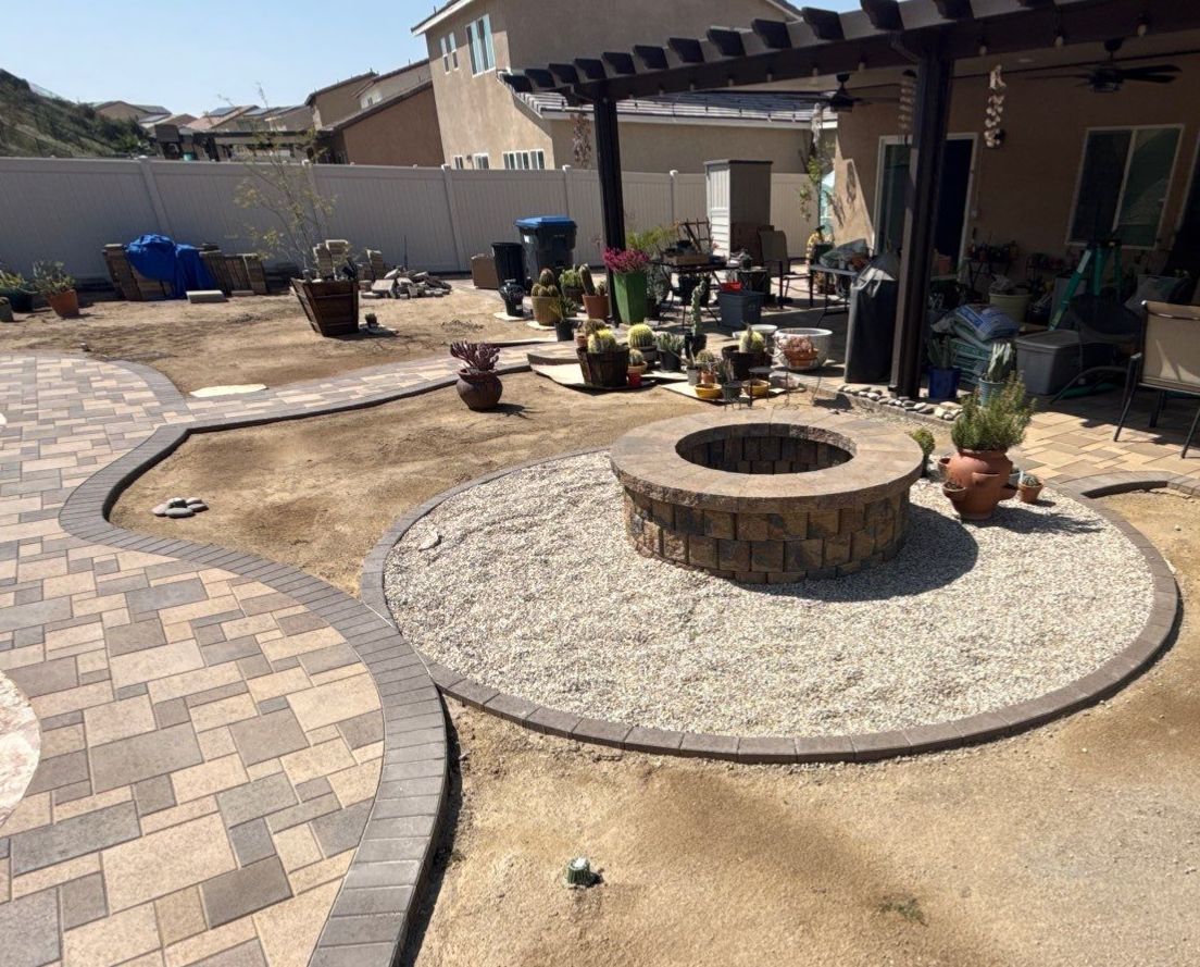 Freeform pool and spa with paver decking by Premier Pools and Spas Temecula