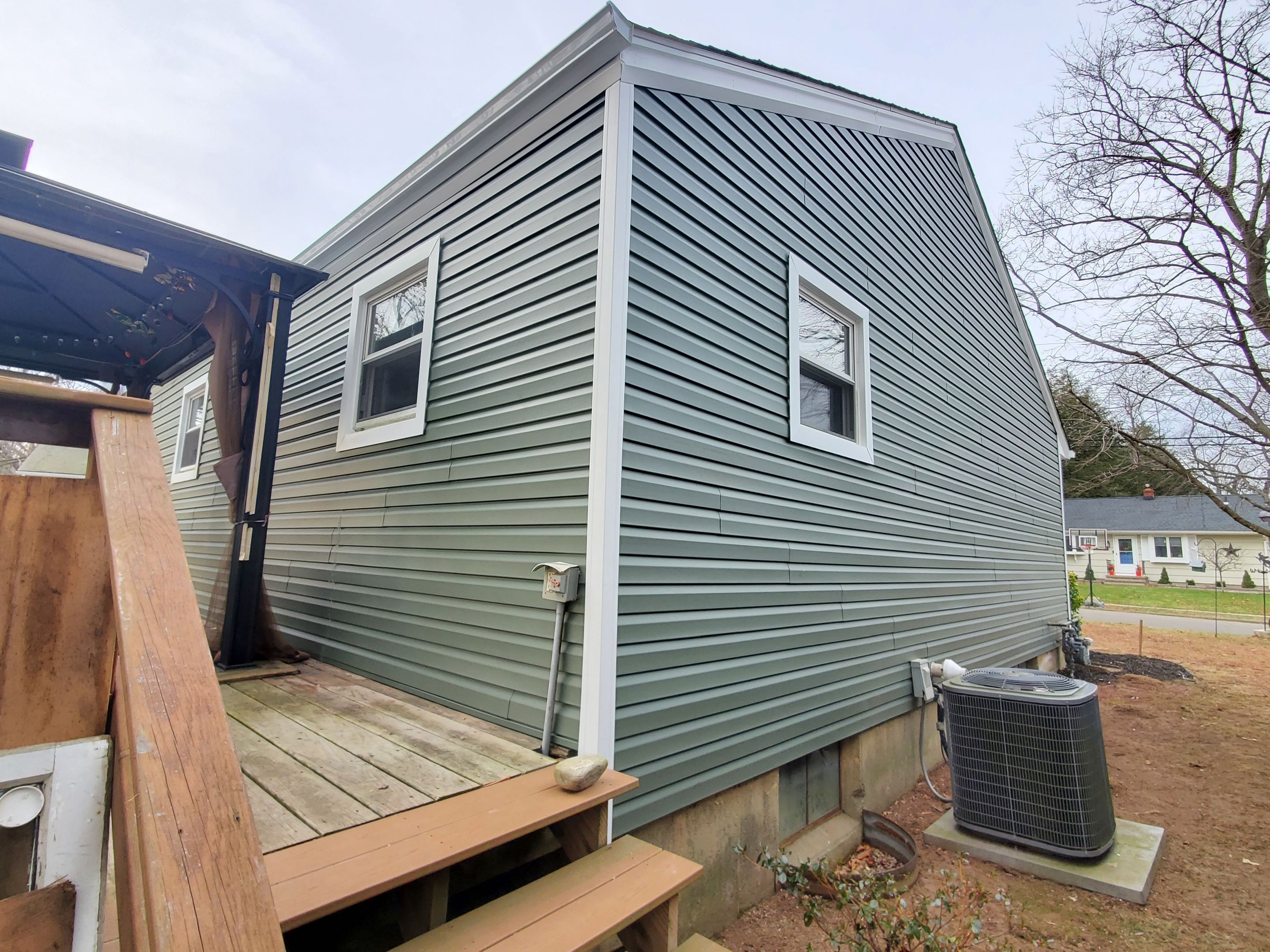 Siding Installation using Certainteed Mainstreet Forest Green by A Plus Exterior
