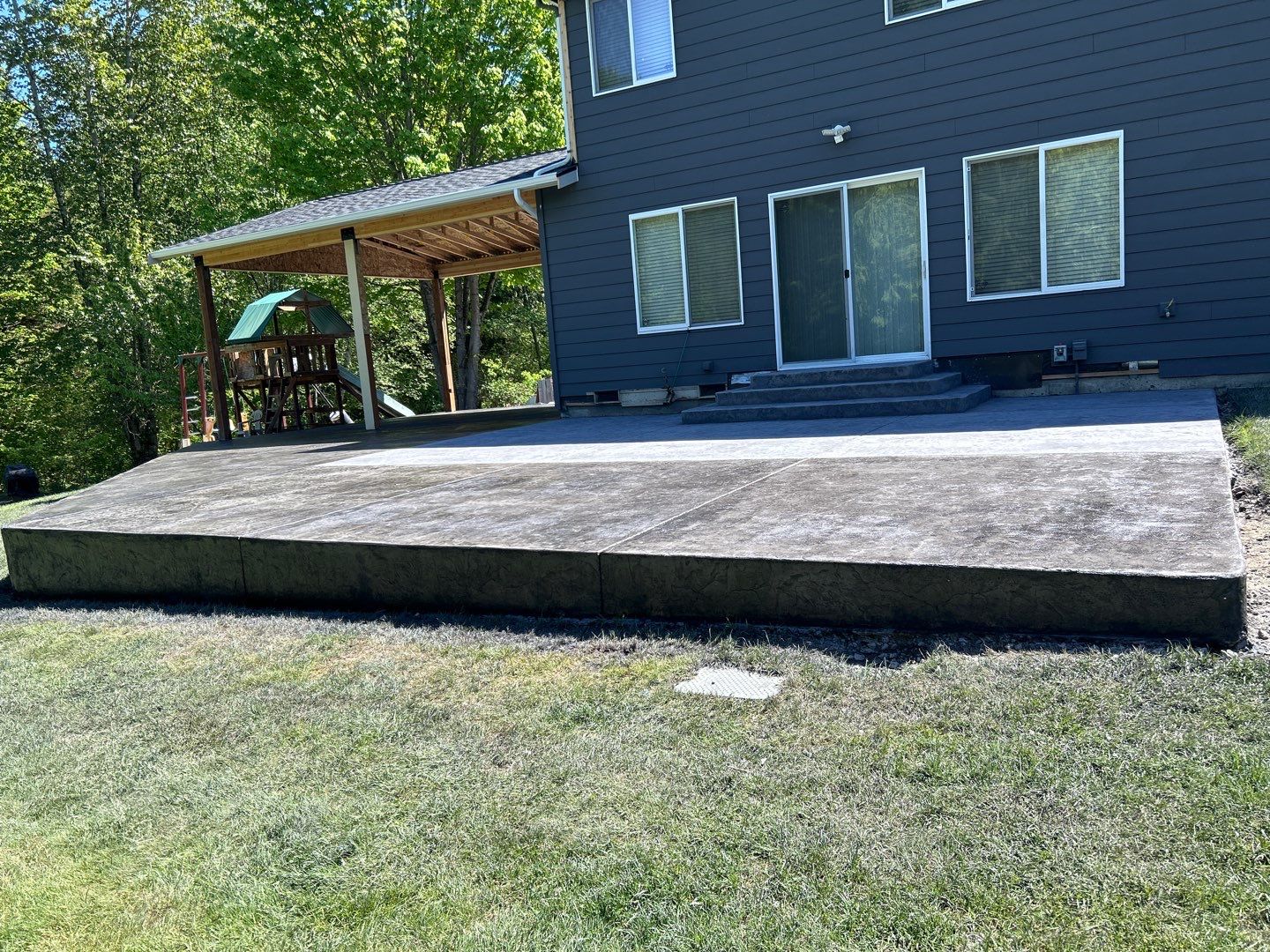 Ty | Concrete Patio by Jireh Asphalt & Concrete Inc 