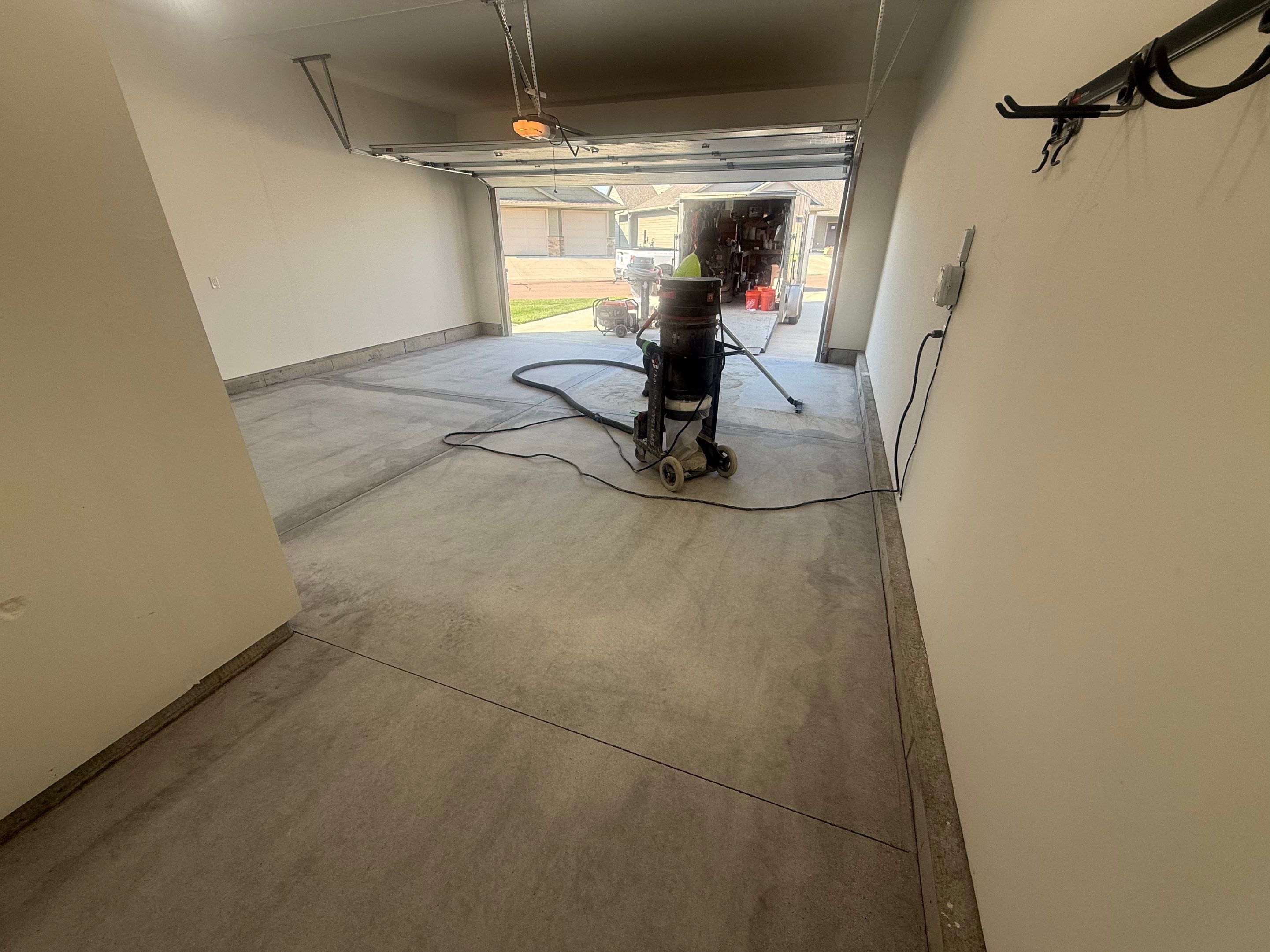 Cabin Fever Garage Floor Coating in Sioux Falls by Select Painting, Coatings & Garage Cabinets