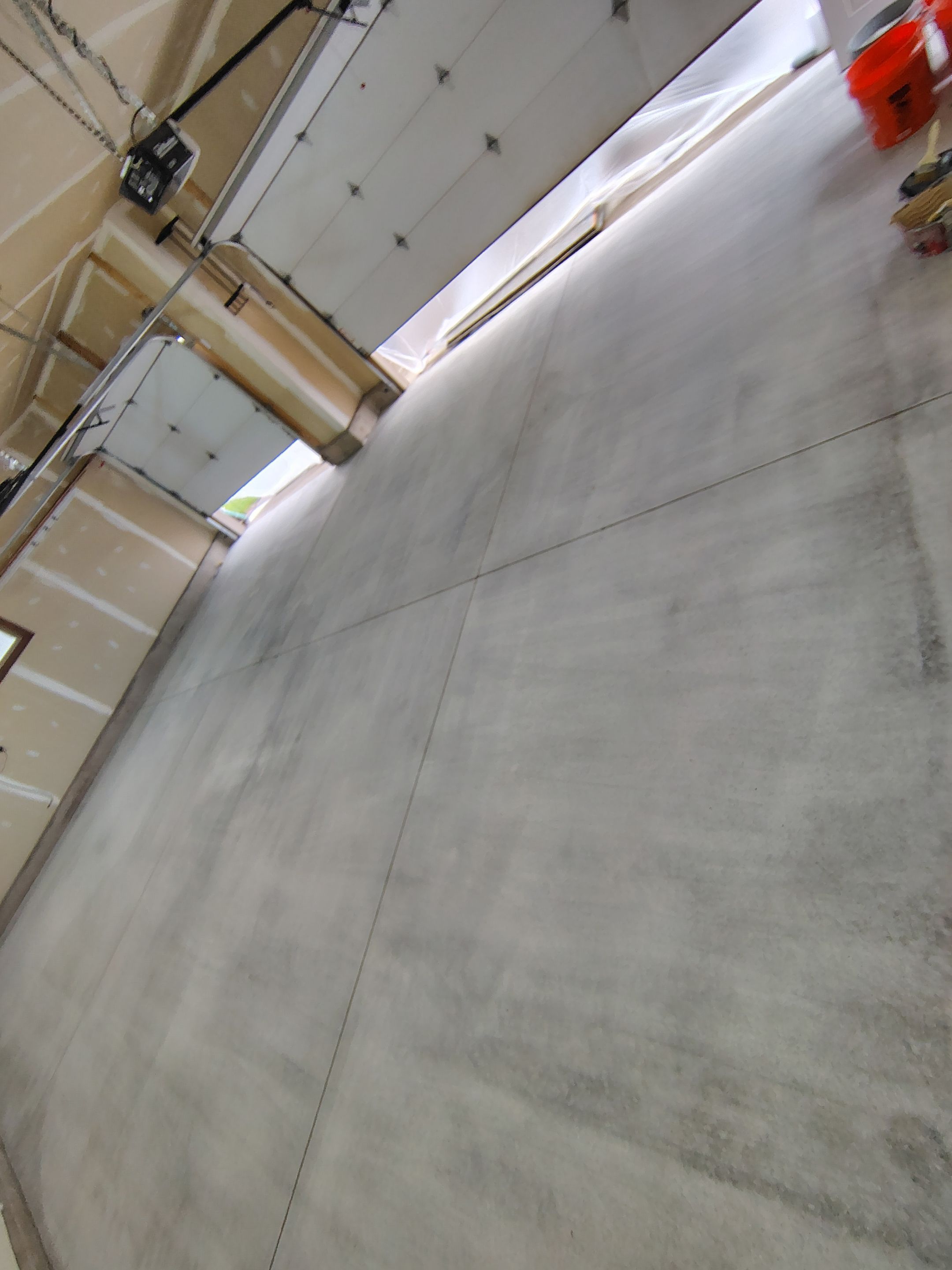Multi-Car Garage Concrete Coating and Epoxy Finish in Sioux Falls by Select Painting, Coatings & Garage Cabinets
